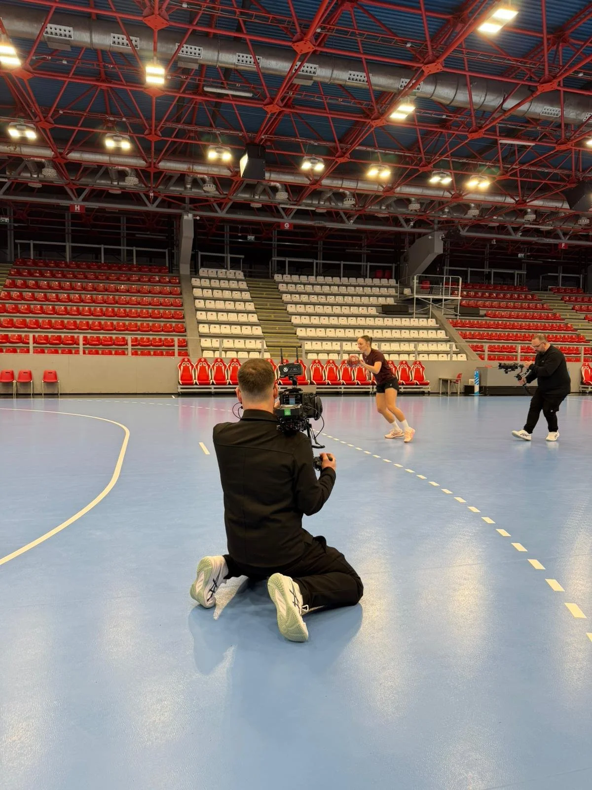 ASICS handball shoot videographer filming sponsored athlete on court in Debrecen arena Hungary — handball photography Ballo Studio