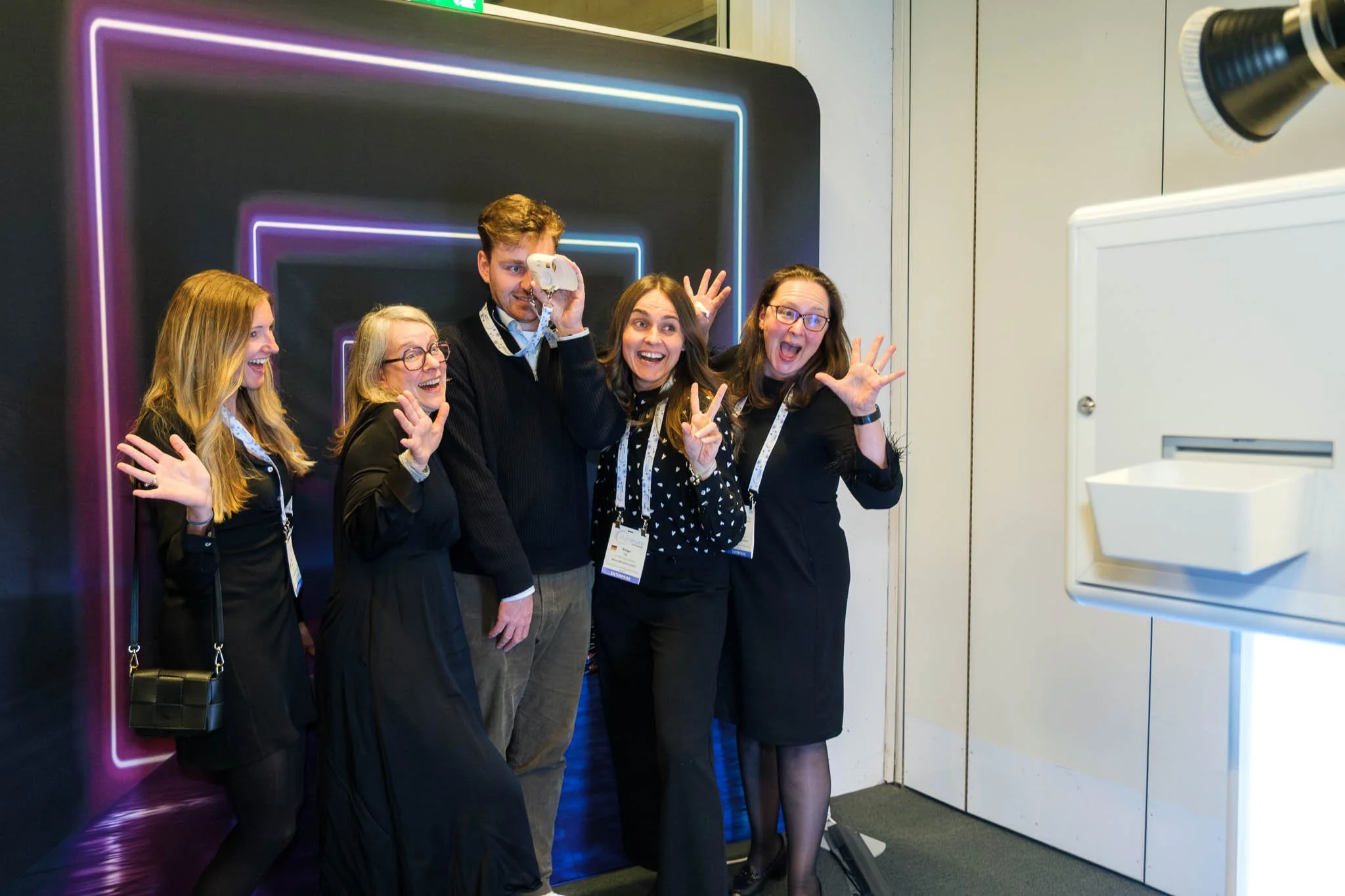Attendees posing at photo booth during Illuminate EMEA 2026 reception — Copenhagen event photography Ballo Studio