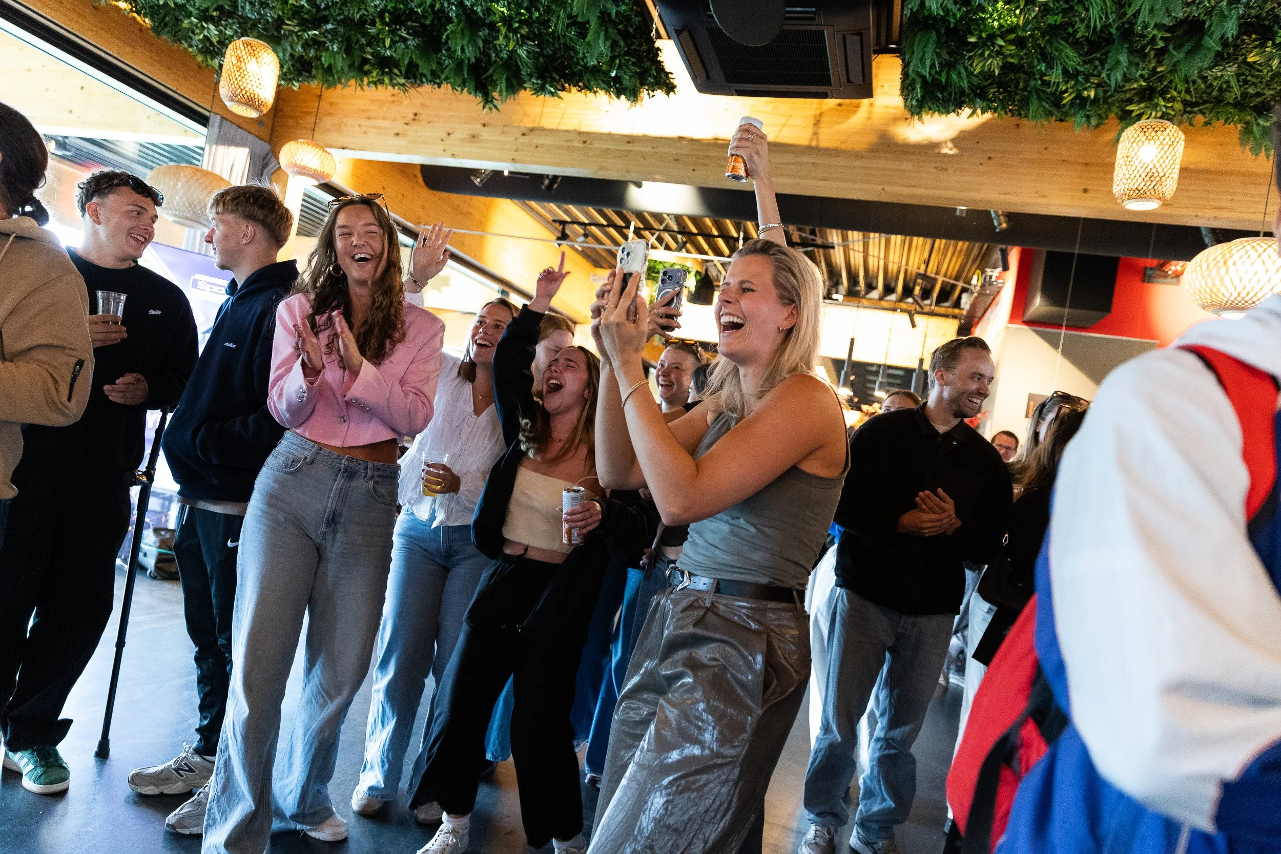 Group of colleagues cheering and celebrating at Adfocup 2026 prize ceremony inside event venue Amsterdam — event photography Amsterdam Ballo Studio