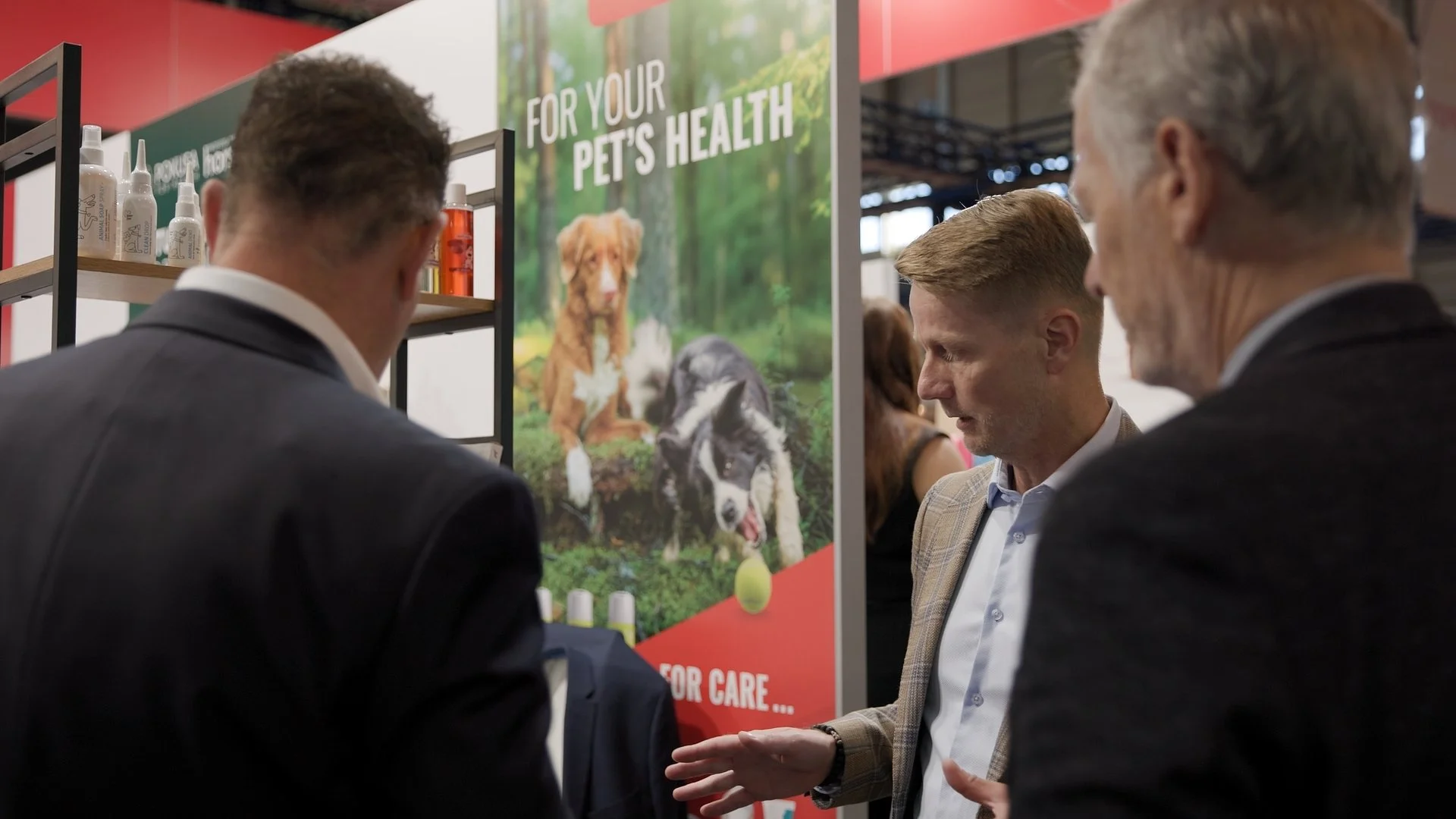 Delegates at Polish pet health products stand during PAIH Business Forward trade show mission — event photography Amsterdam Ballo Studio