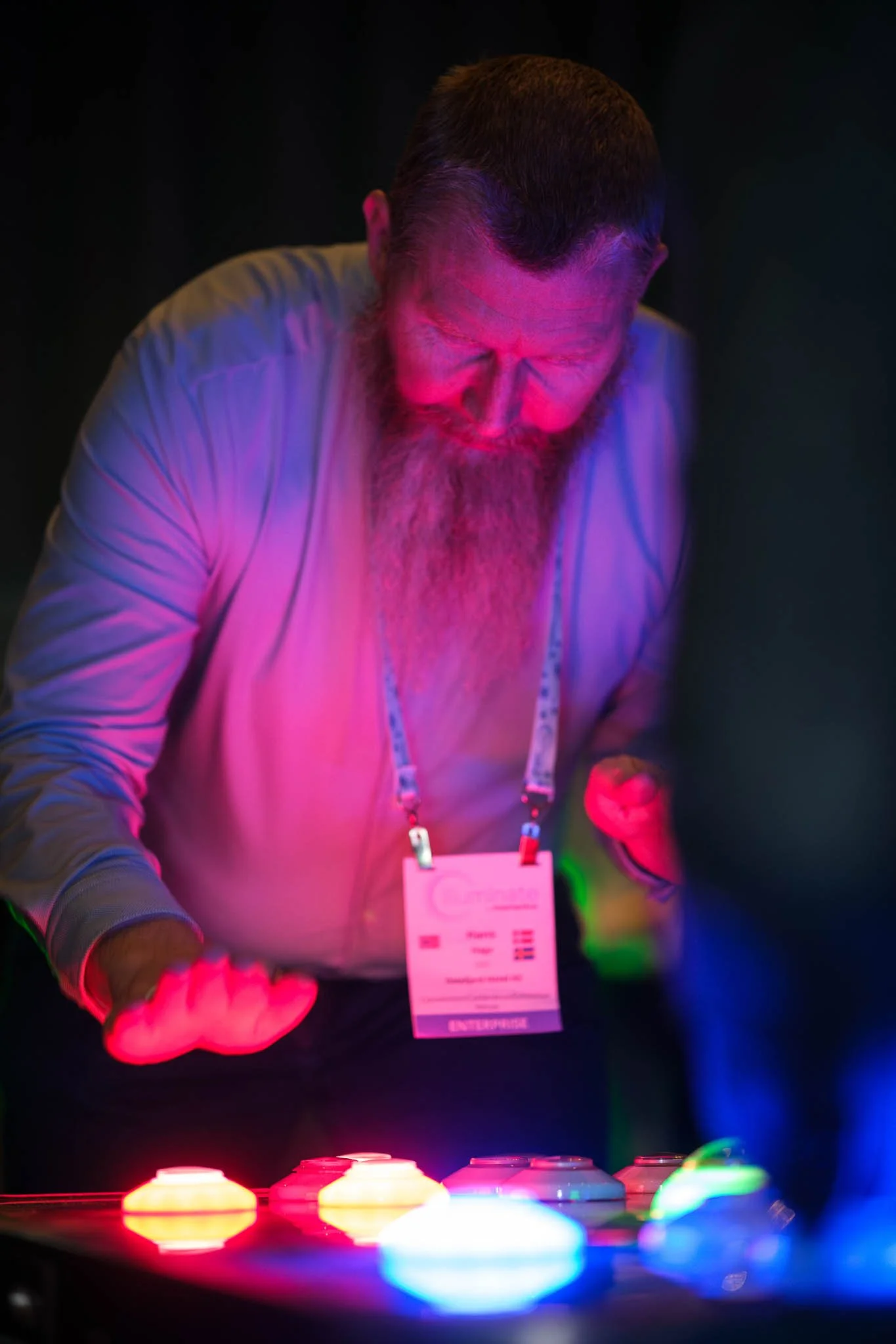 DJ operating lighting desk at Illuminate EMEA 2026 gala dinner — Copenhagen corporate event photography Ballo Studio