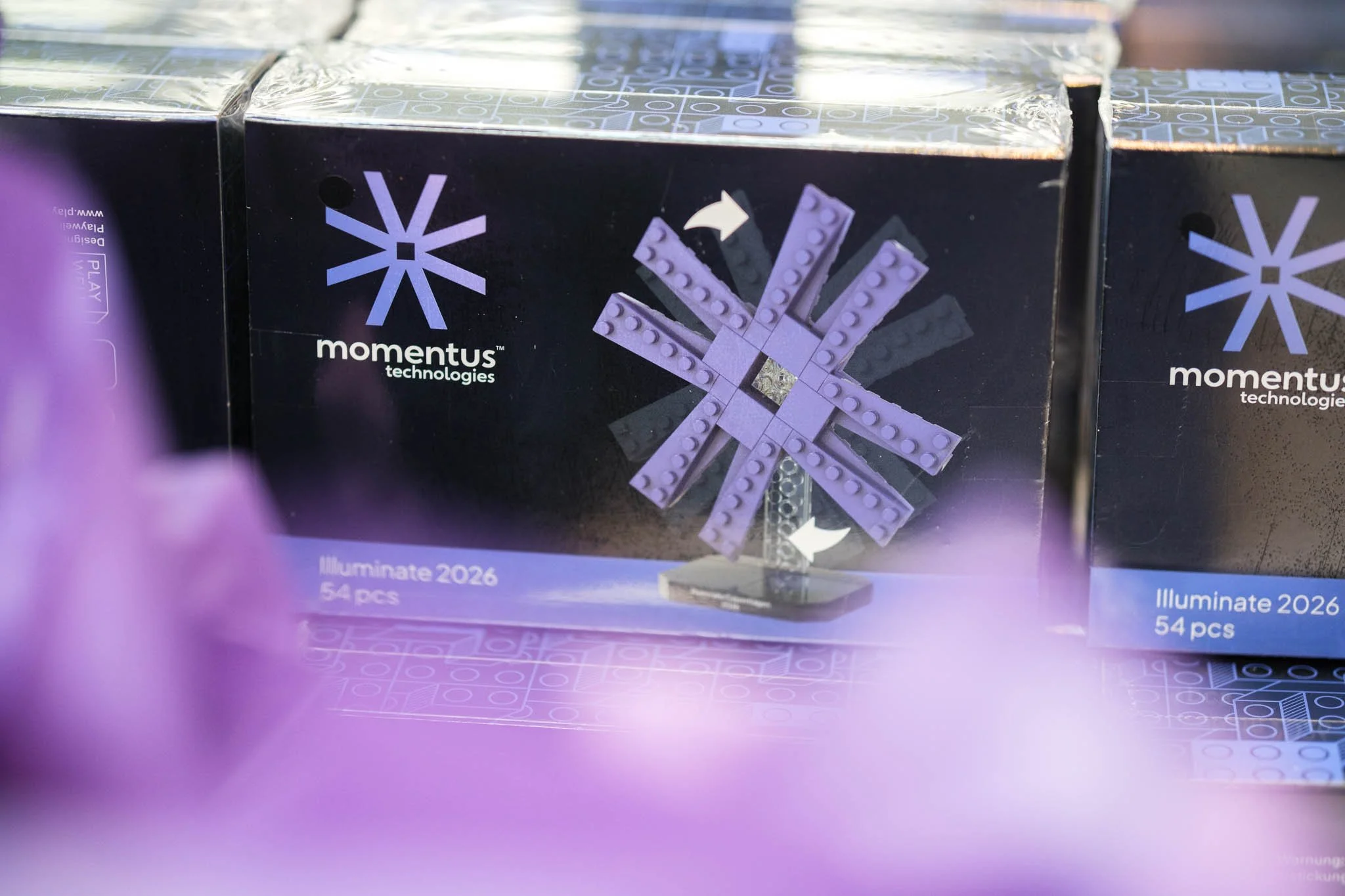 Momentus Technologies branded Illuminate 2026 delegate gift boxes at Copenhagen conference — event photography Ballo Studio