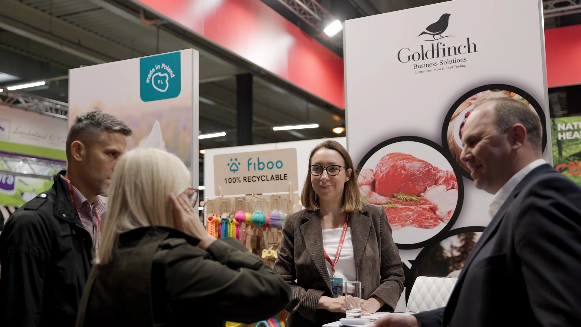 Polish and international exhibitors meeting at PAIH Business Forward trade show with multiple company stands — conference photography Amsterdam Ballo Studio