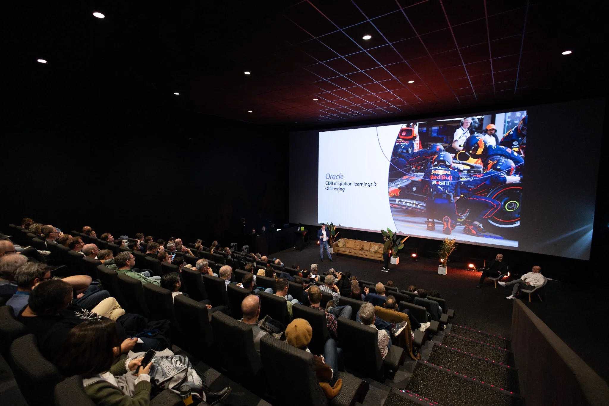 Rabobank QBR presentation in Kinepolis cinema auditorium with large screen and seated audience — corporate event photographer Amsterdam Ballo Studio