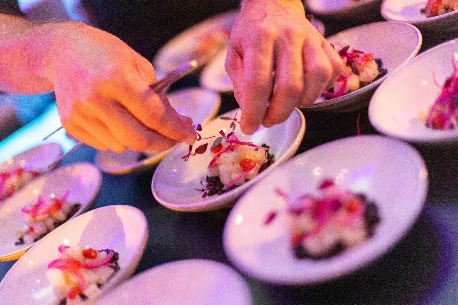 Chef plating elegant amuse-bouche dishes for corporate gala dinner in Amsterdam — gala dinner photography Amsterdam Ballo Studio