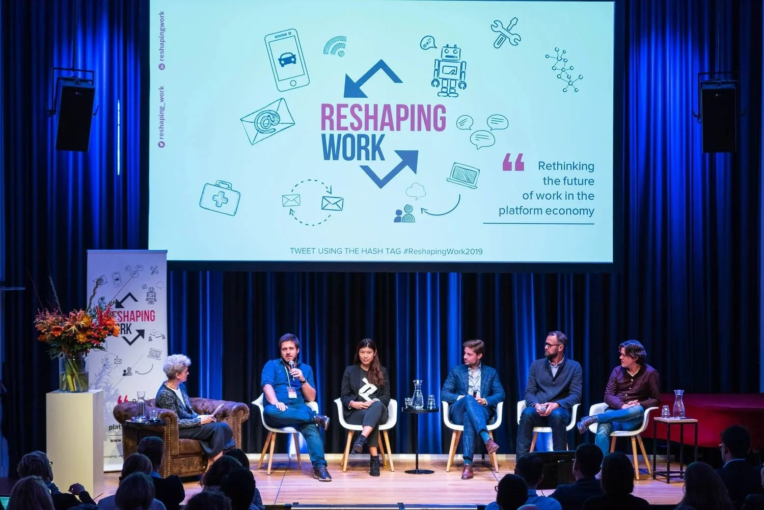 Full panel on stage at Reshaping Work conference on future of work in the platform economy Amsterdam — event photography Amsterdam Ballo Studio