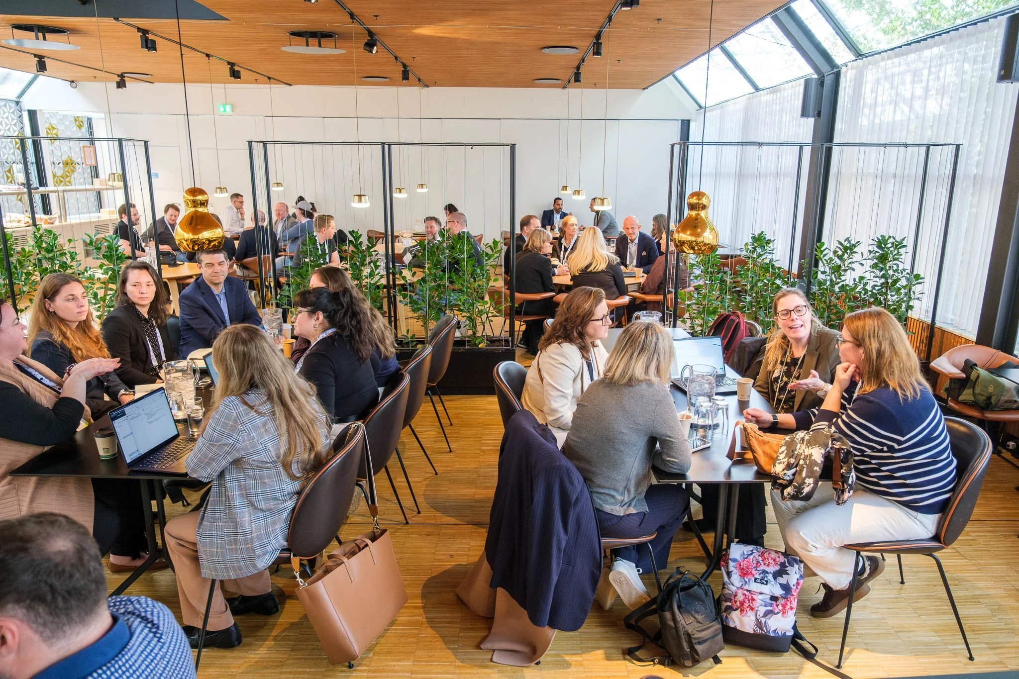 Delegates seated for dinner at Illuminate EMEA 2026 gala in Scandinavian venue — Copenhagen event photography Ballo Studio
