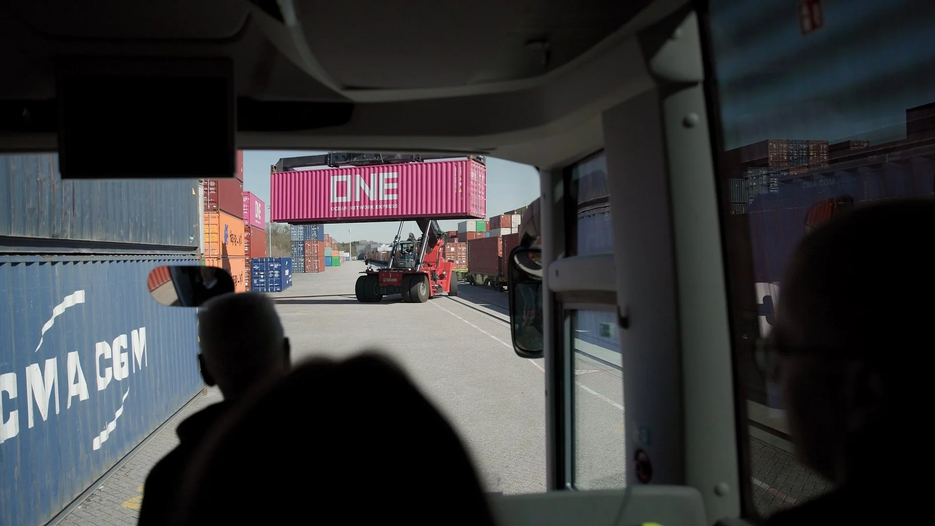 Delegates on port facility tour during PAIH Polish-Dutch Economic Mission with shipping containers and cranes — conference photography Amsterdam Ballo Studio