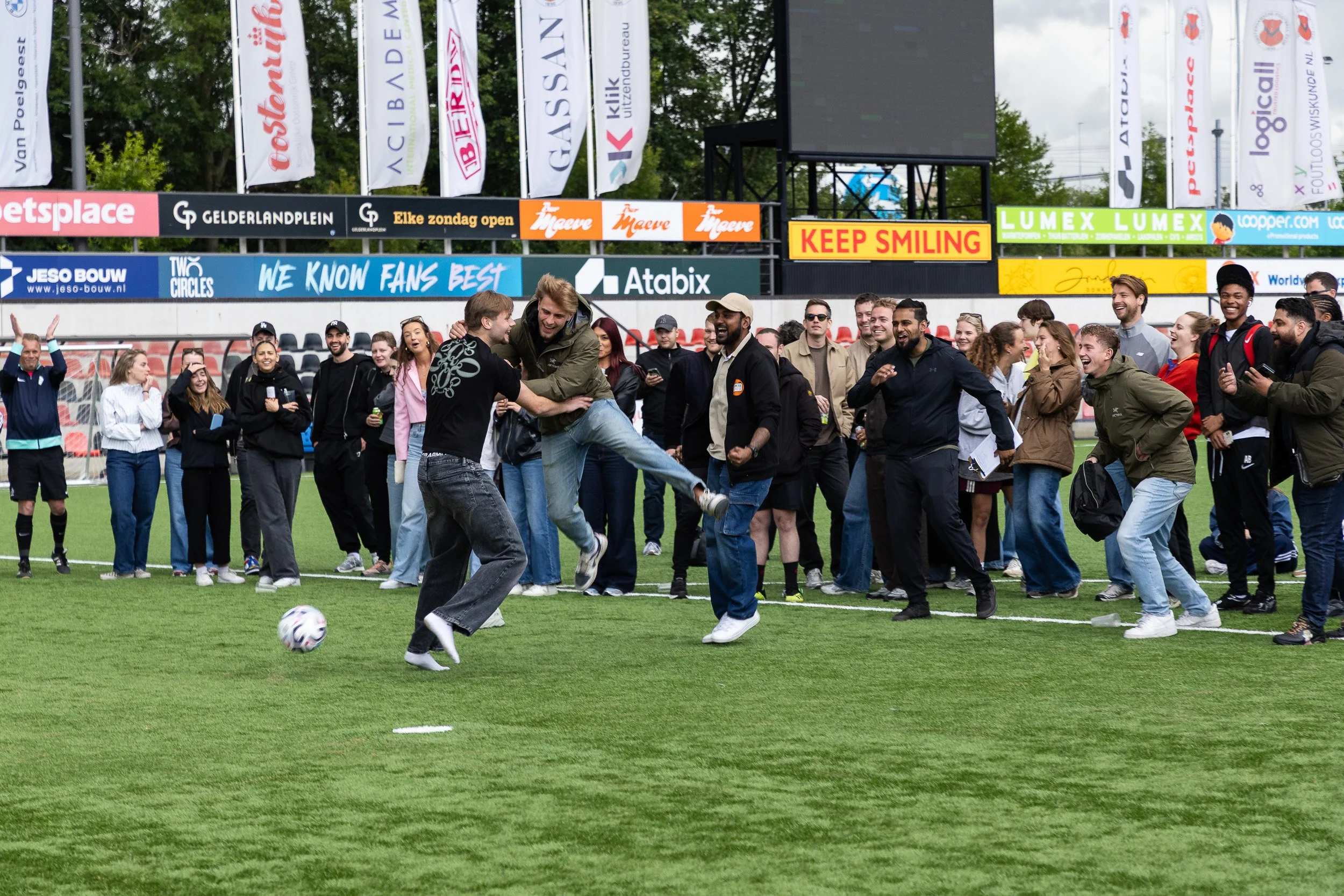 Crowd cheering as participants compete in a fun penalty shootout at Adfocup 2026 advertising industry football tournament Amsterdam — event photography Amsterdam Ballo Studio