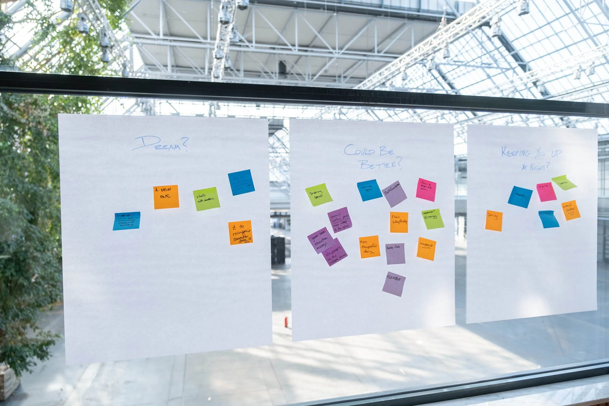 Workshop brainstorming boards covered in colourful sticky notes at Illuminate EMEA 2026 — Copenhagen conference photography Ballo Studio