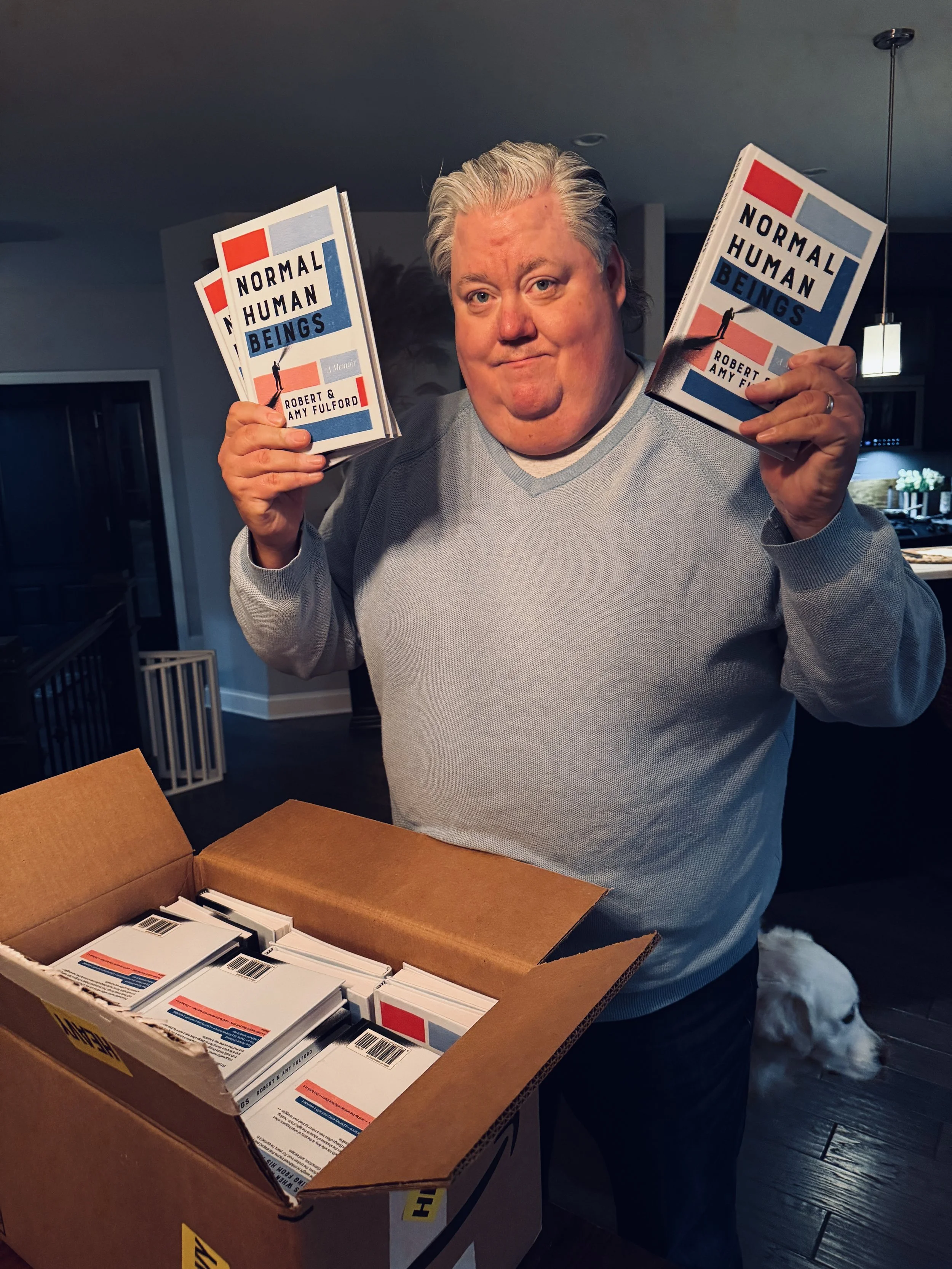 Robert Fulford holding his book