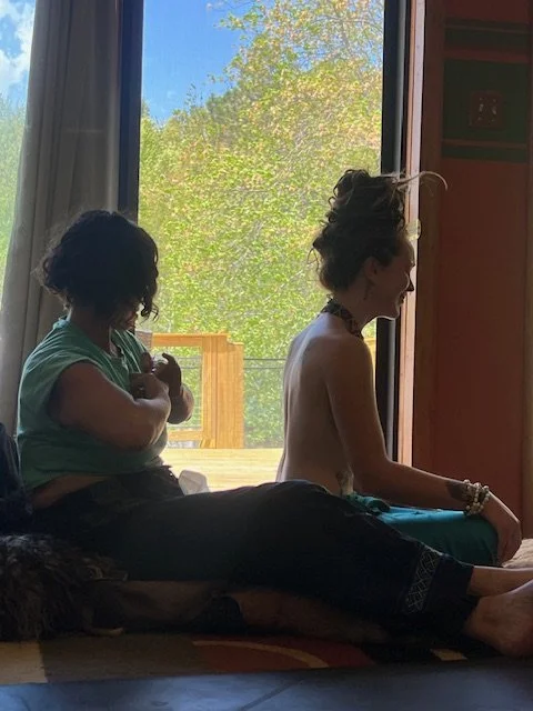 - Heather Dexter supporting participant during Kambo ceremony.