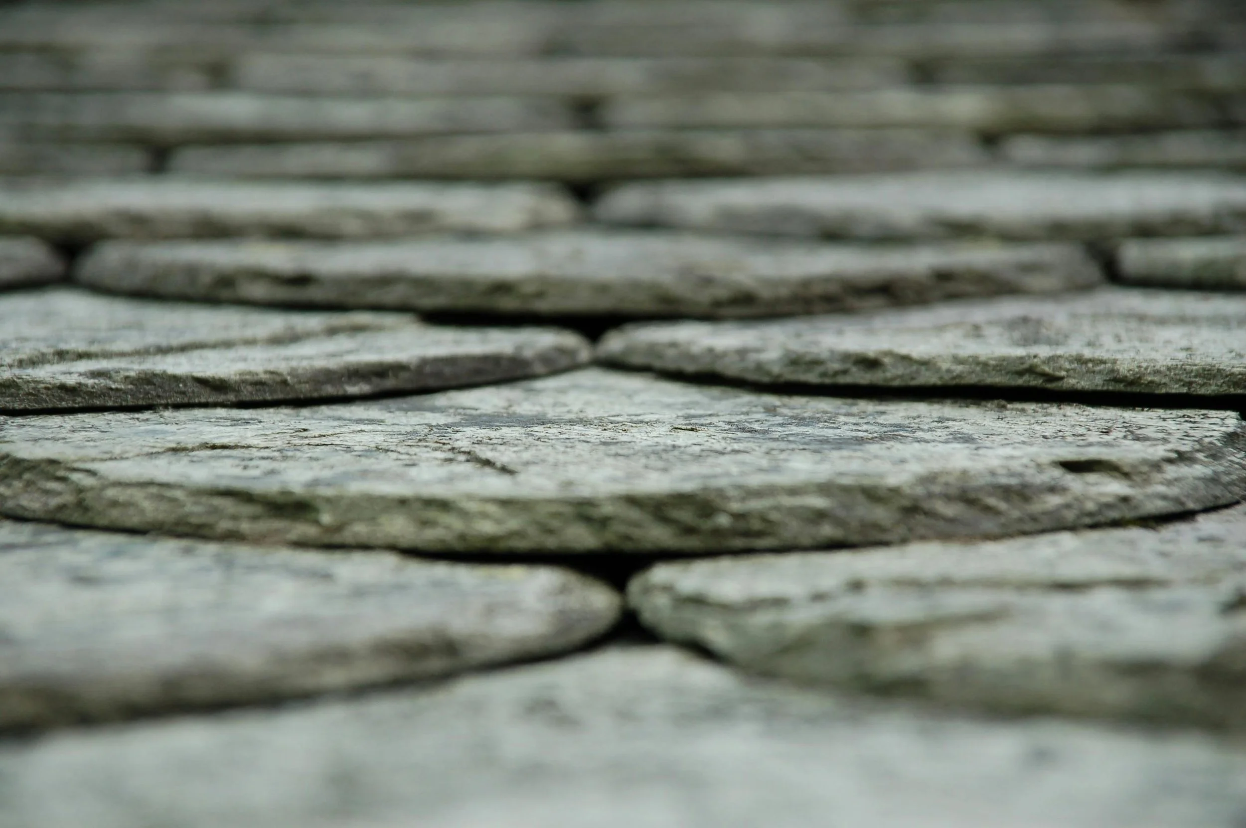 Close-up of weathered gray wooden planks arranged horizontally.