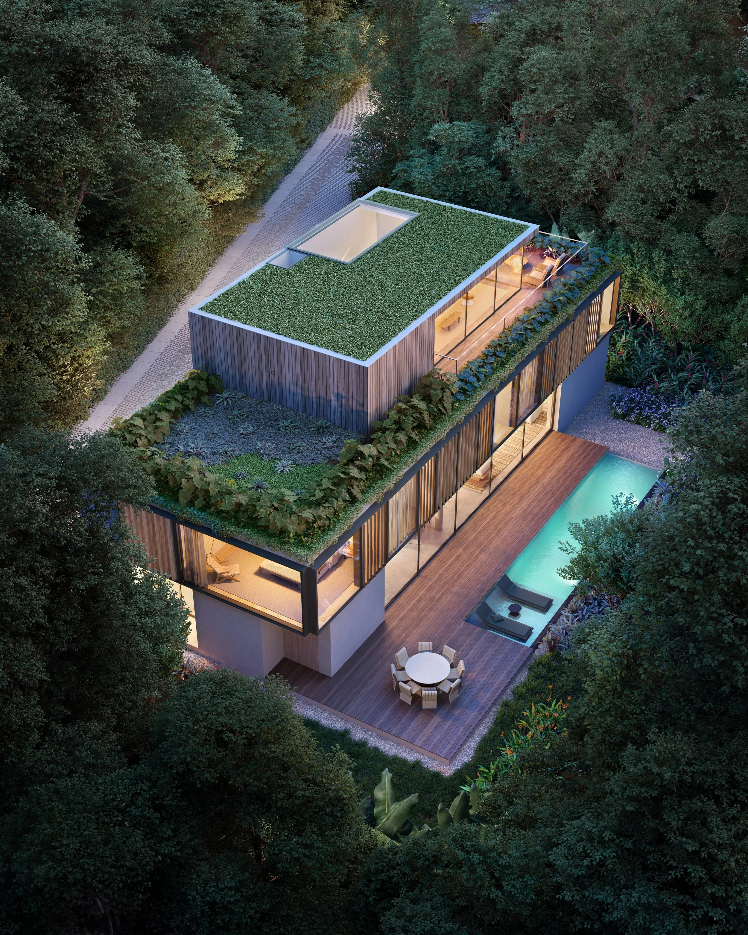 Vista aérea de uma casa moderna com telhado verde assinada por Arthur Casas, piscina e área ao ar livre, cercada por árvores.