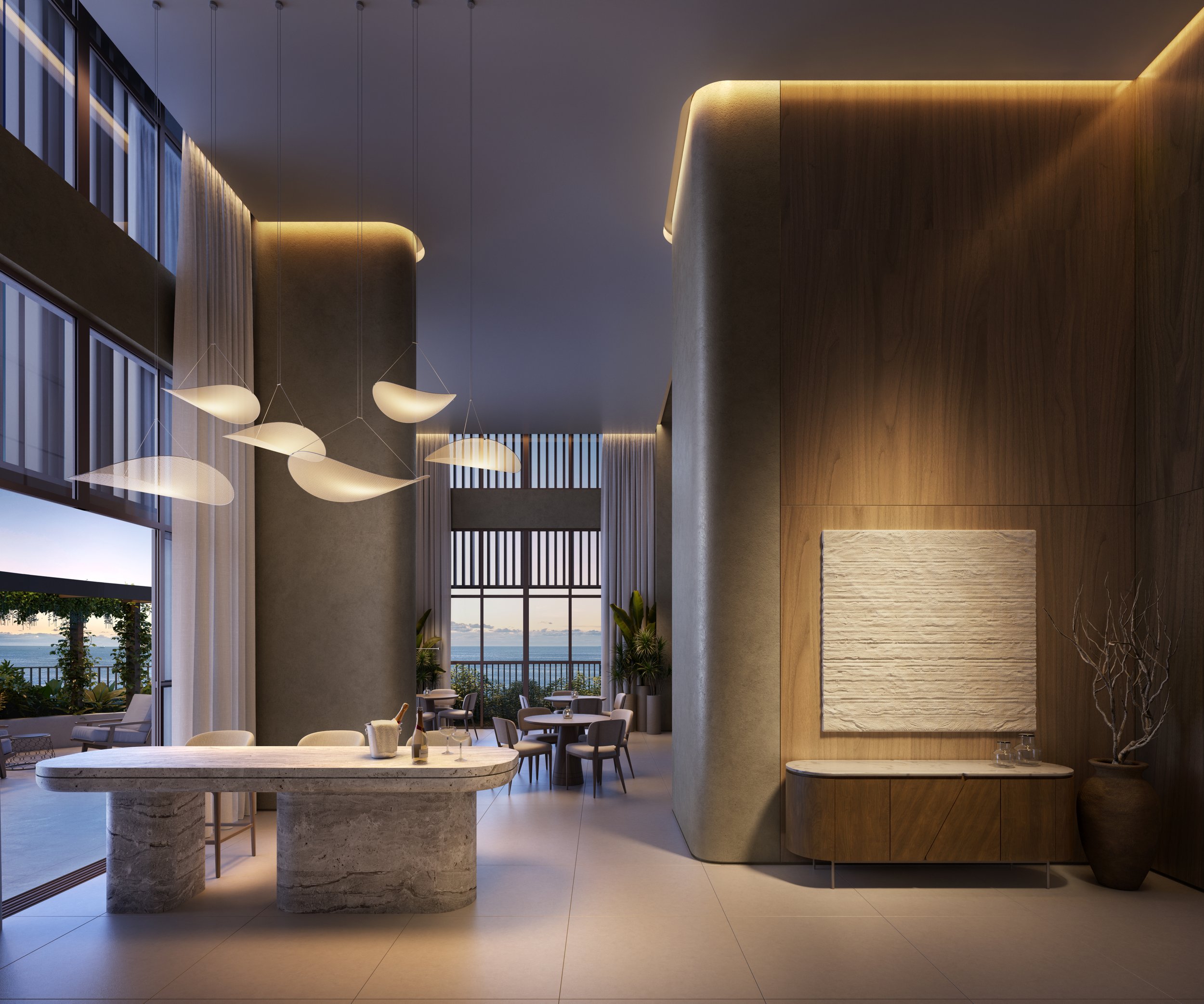 Interior de um restaurante ou lounge sofisticado com iluminação moderna, mesas e cadeiras confortáveis, vista para o mar ao fundo.