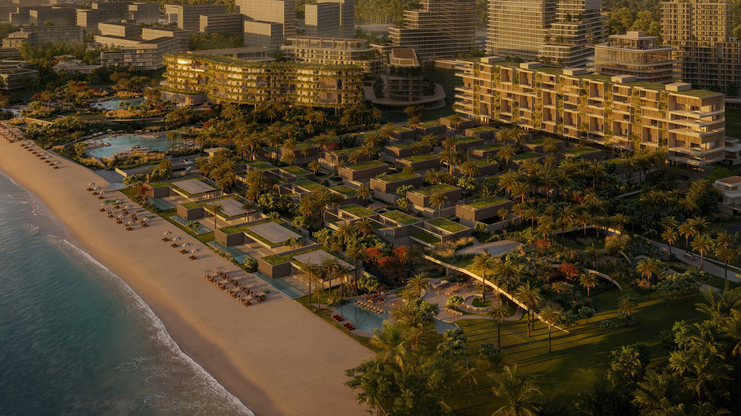 Imagem aérea de um complexo residencial à beira-mar com prédios modernos, jardins, piscina e praia com espreguiçadeiras.