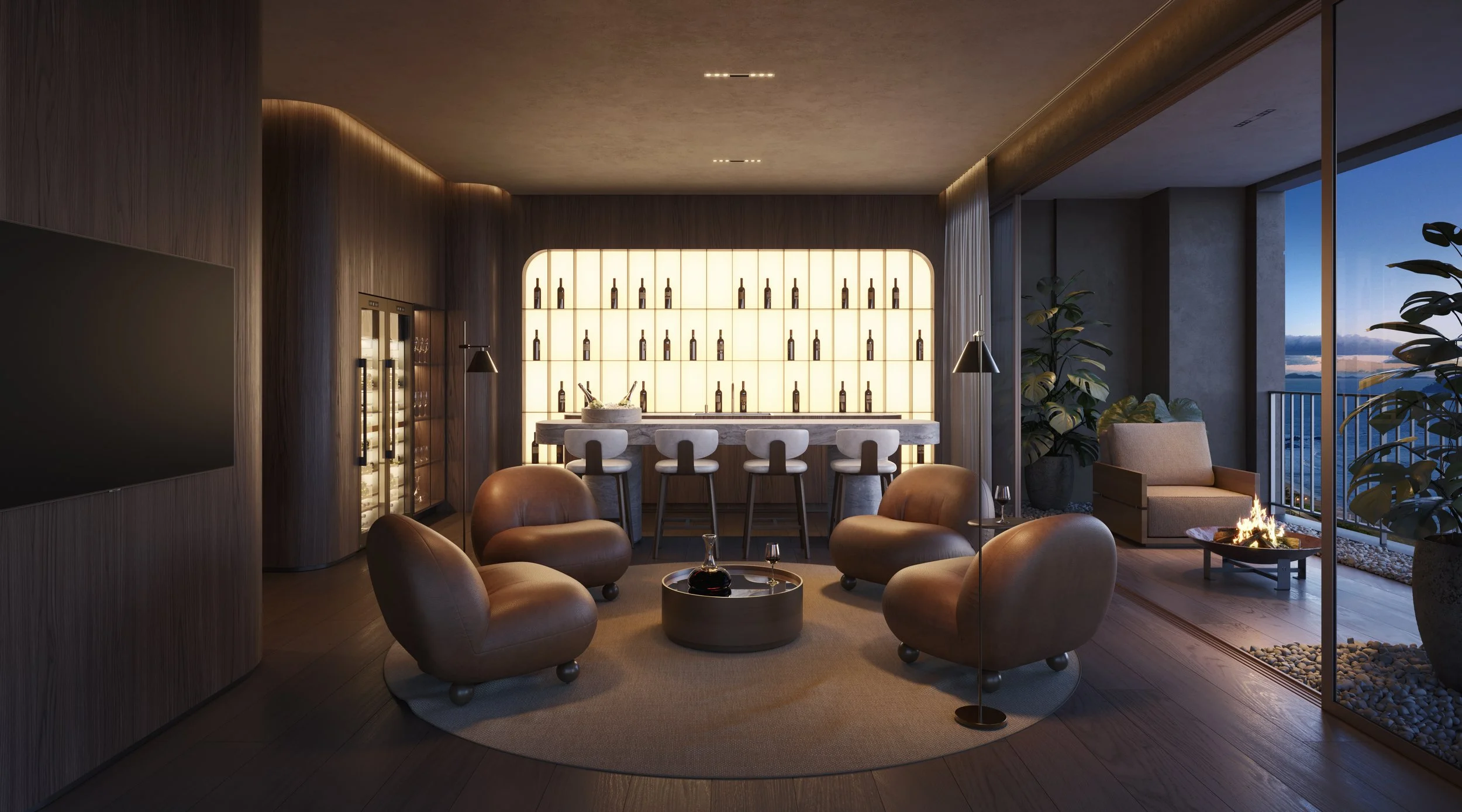 Sala de estar com móveis de couro, iluminação suave, uma área de bar ao fundo com garrafas na parede iluminada, e uma lareira de fogo ao lado de uma varanda com vista para o pôr do sol.