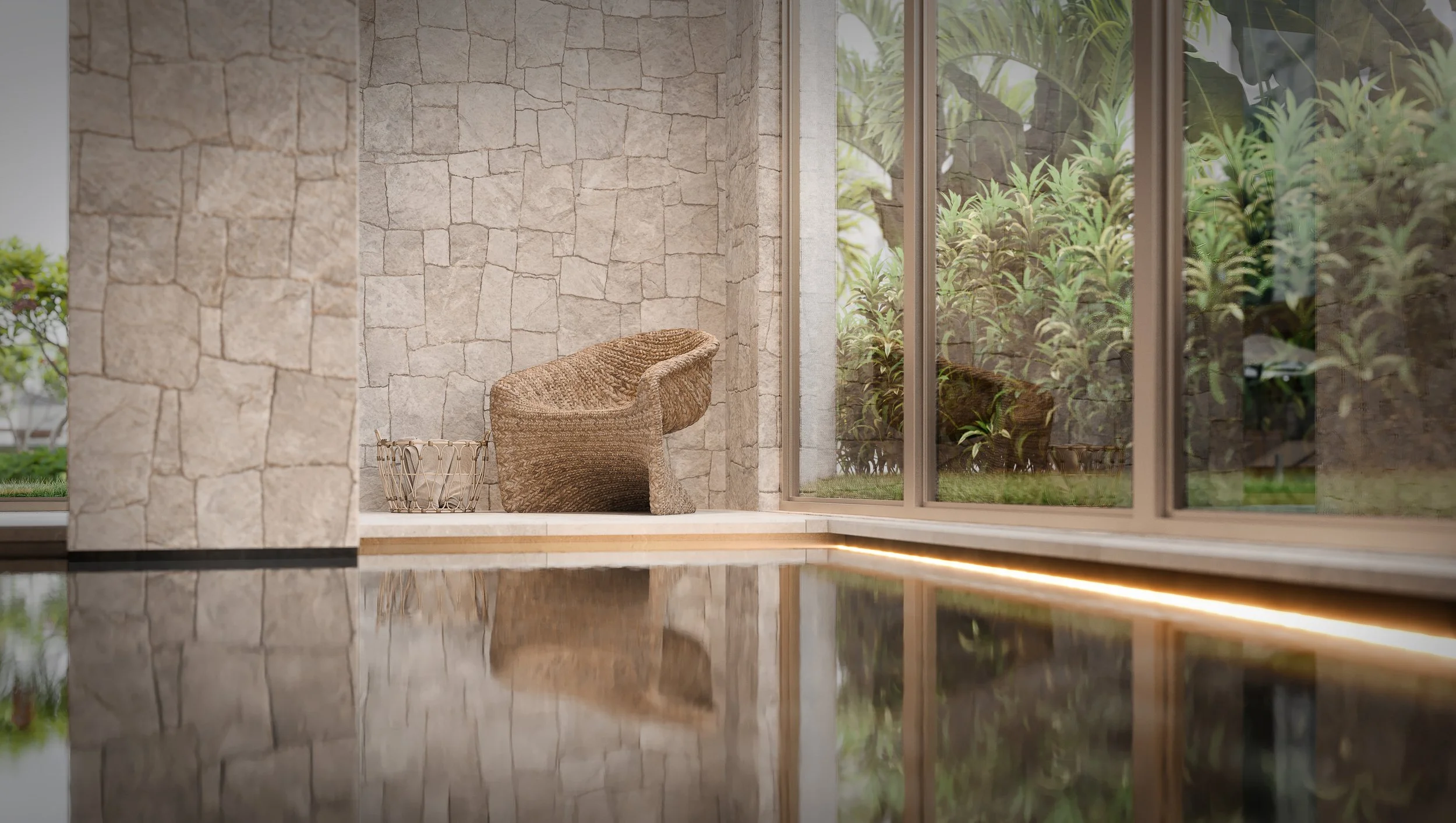 Espreguiçadeira de fibra natural próxima a uma parede de pedra, vista de dentro de uma piscina, com janelas grandes que mostram plantas verdes do lado de fora.