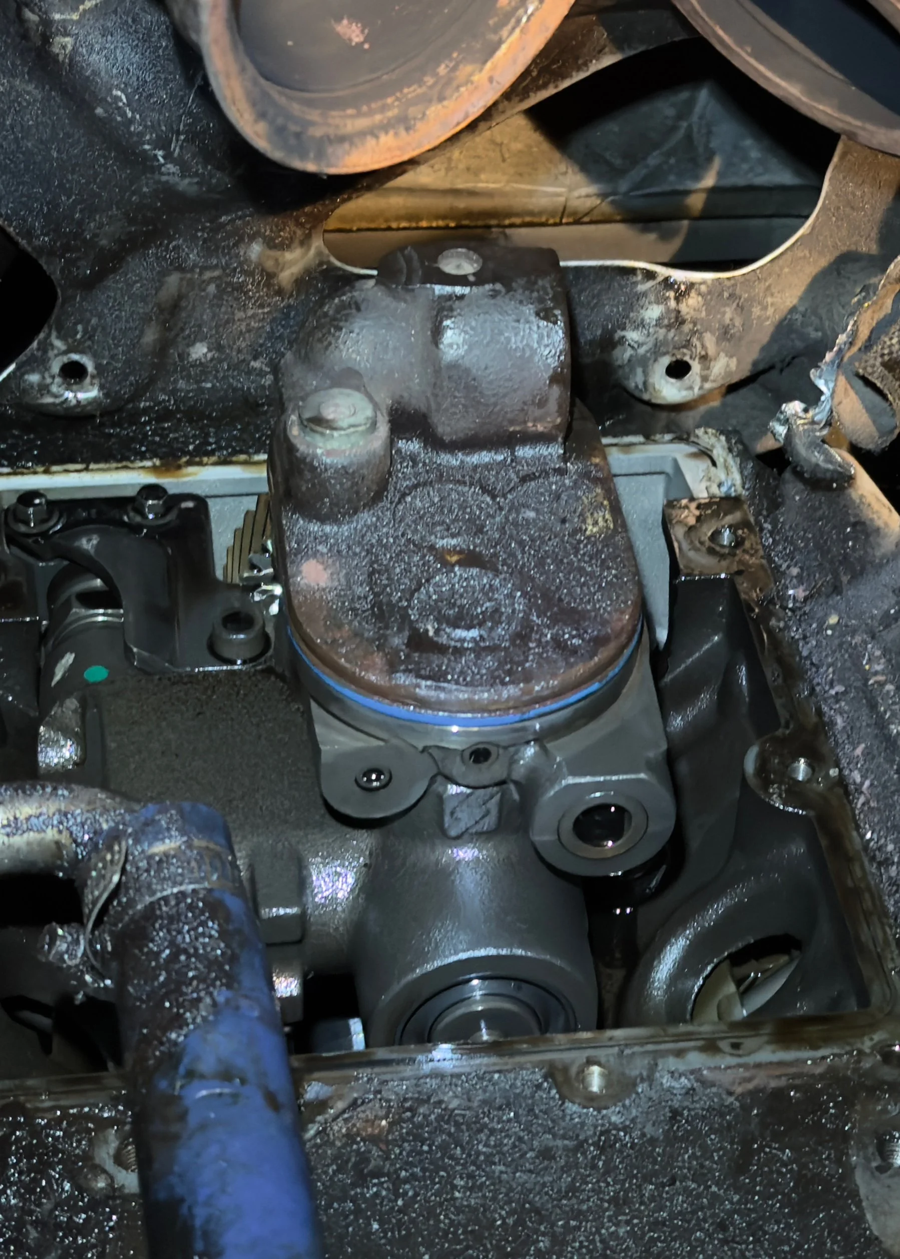 Close-up of a Ford Powerstroke HEUI high-pressure oil pump on the engine block
