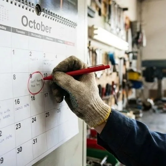 ALP Enterprises technician reviewing notes before a mobile service call