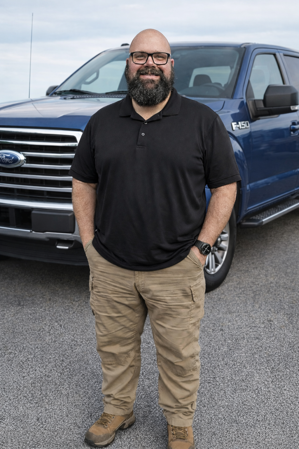 Owner Matt standing in front of service truck