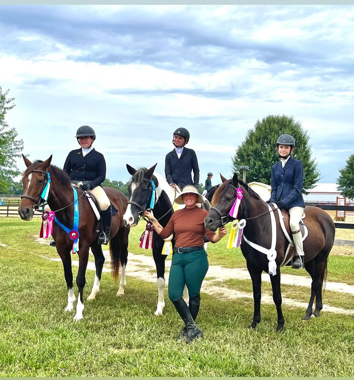 students and equine friends with riding instructor