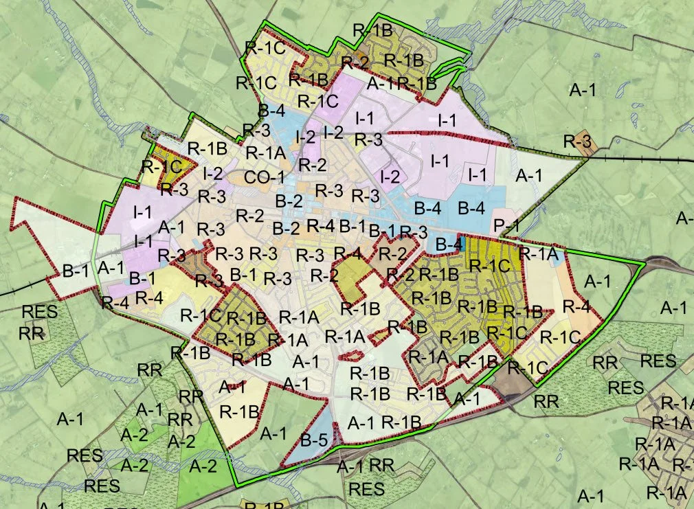 County Zones (Red Boundaries)                                                     within the                                                                                     
City Limits (Green Boundary)
