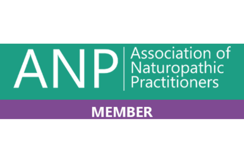 Logo of the Association of Naturopathic Practitioners with green and purple color blocks and white text