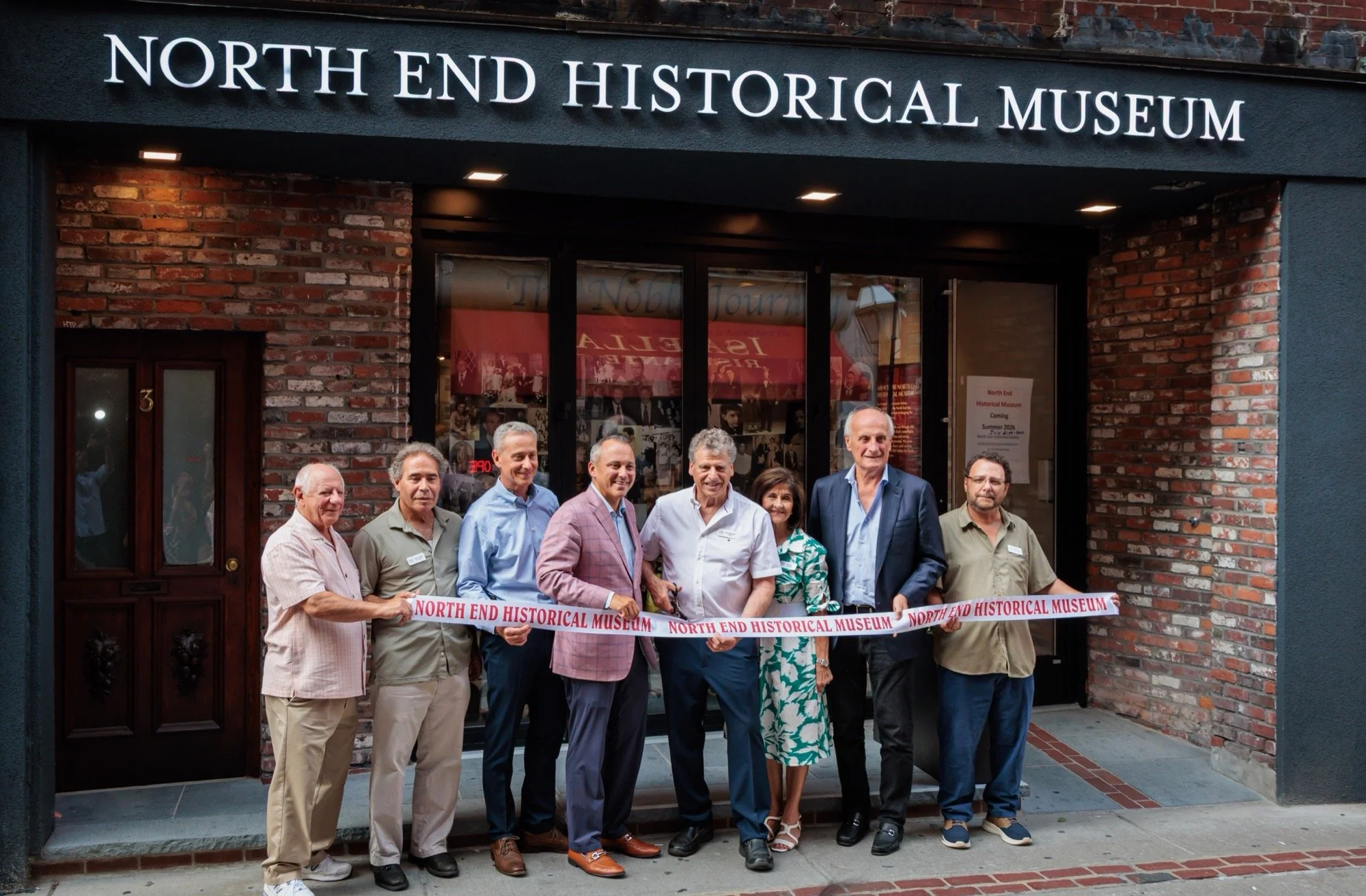 Ribbon cutting outside the North End Historical Museum at 3 Prince Street.