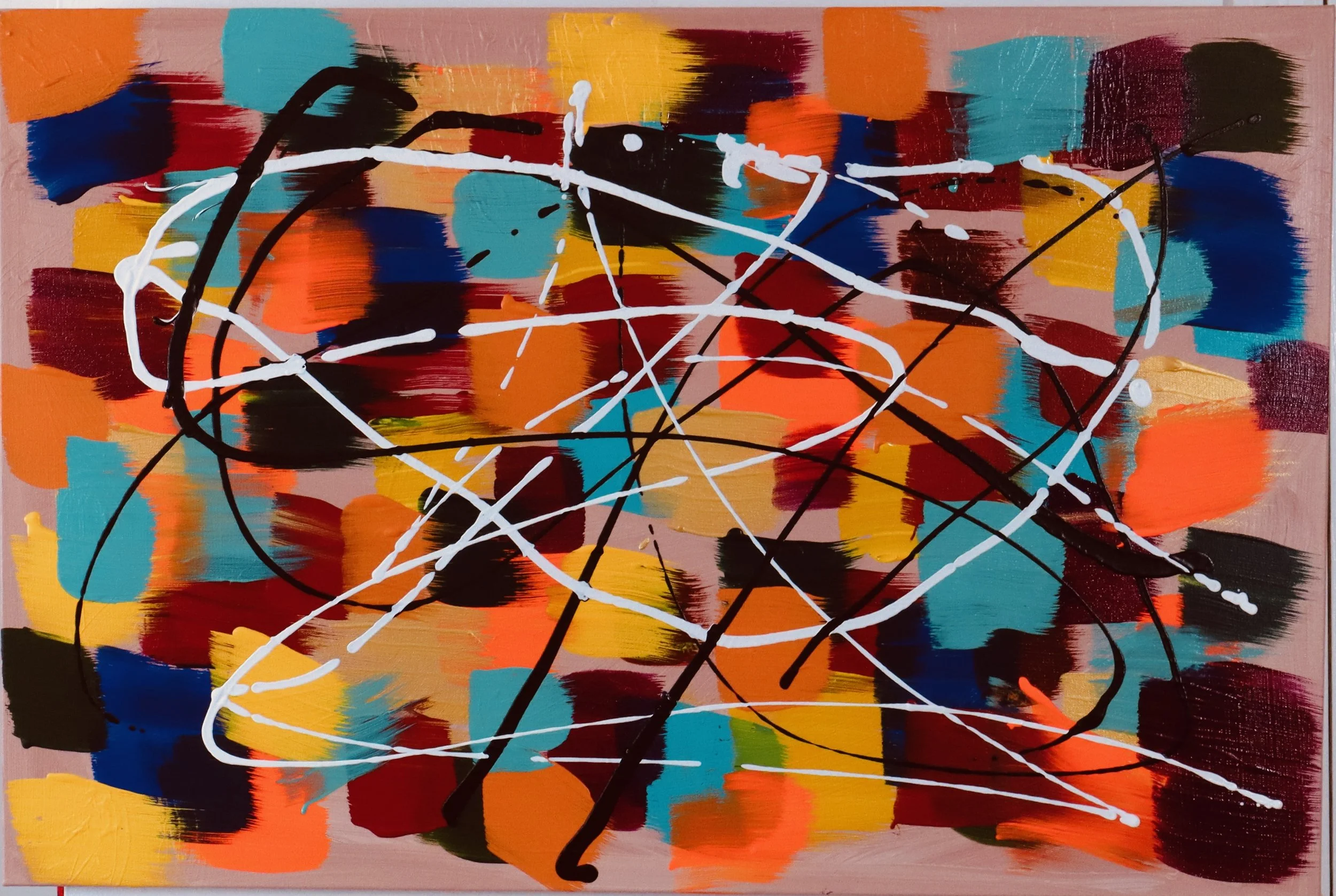 Abstract painting with multicolored brushstrokes in orange, yellow, red, blue, teal, black, and pink, overlaid with white and black splatter lines.