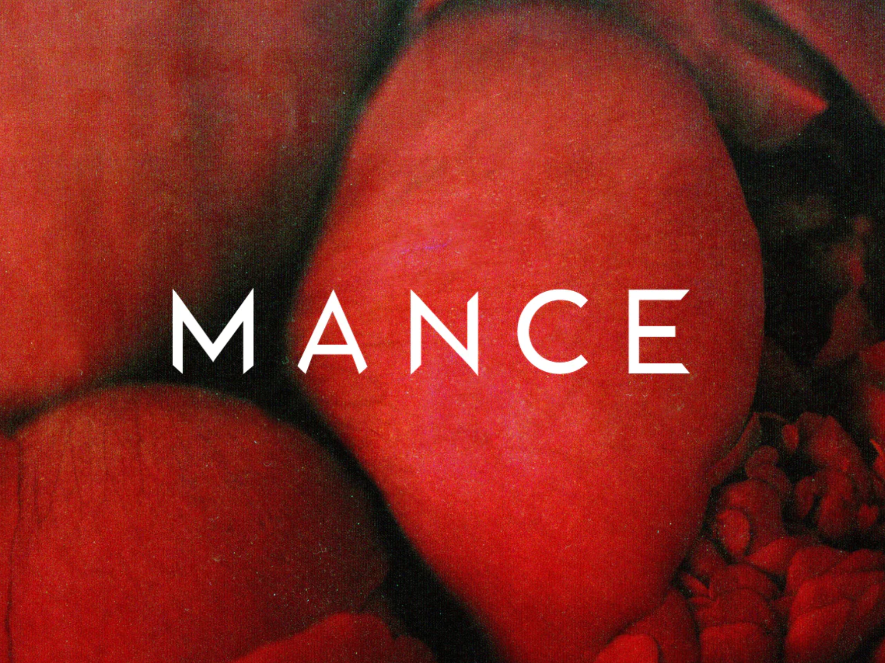 Close-up of red apples and small red berries with the word 'MANCE' overlaid.