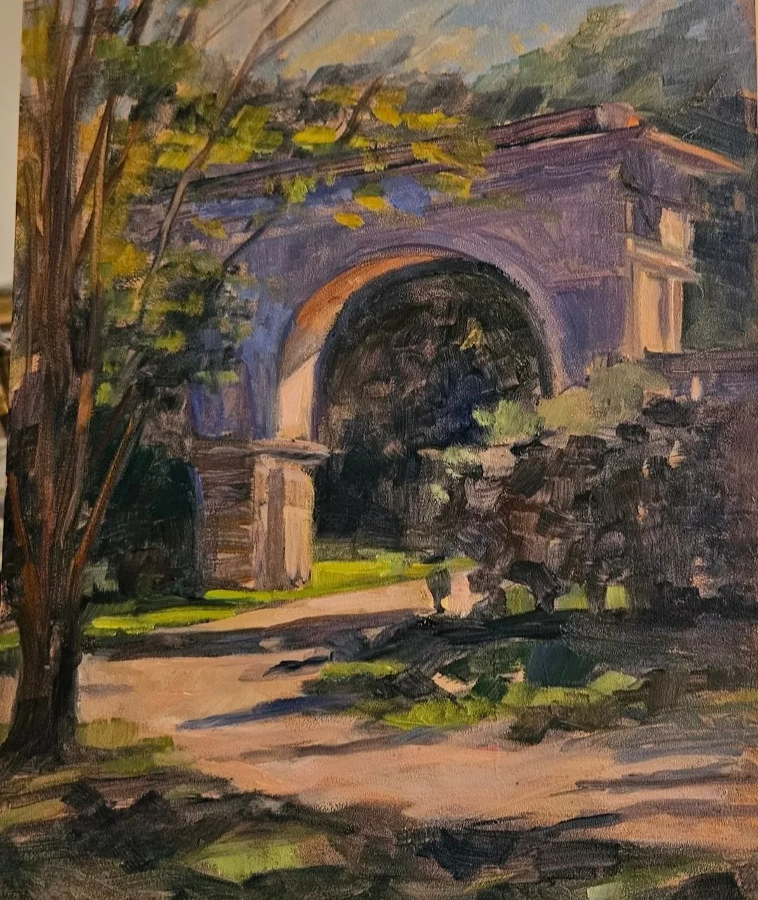 An impressionist painting of a stone bridge with an arch, surrounded by greenery and trees.