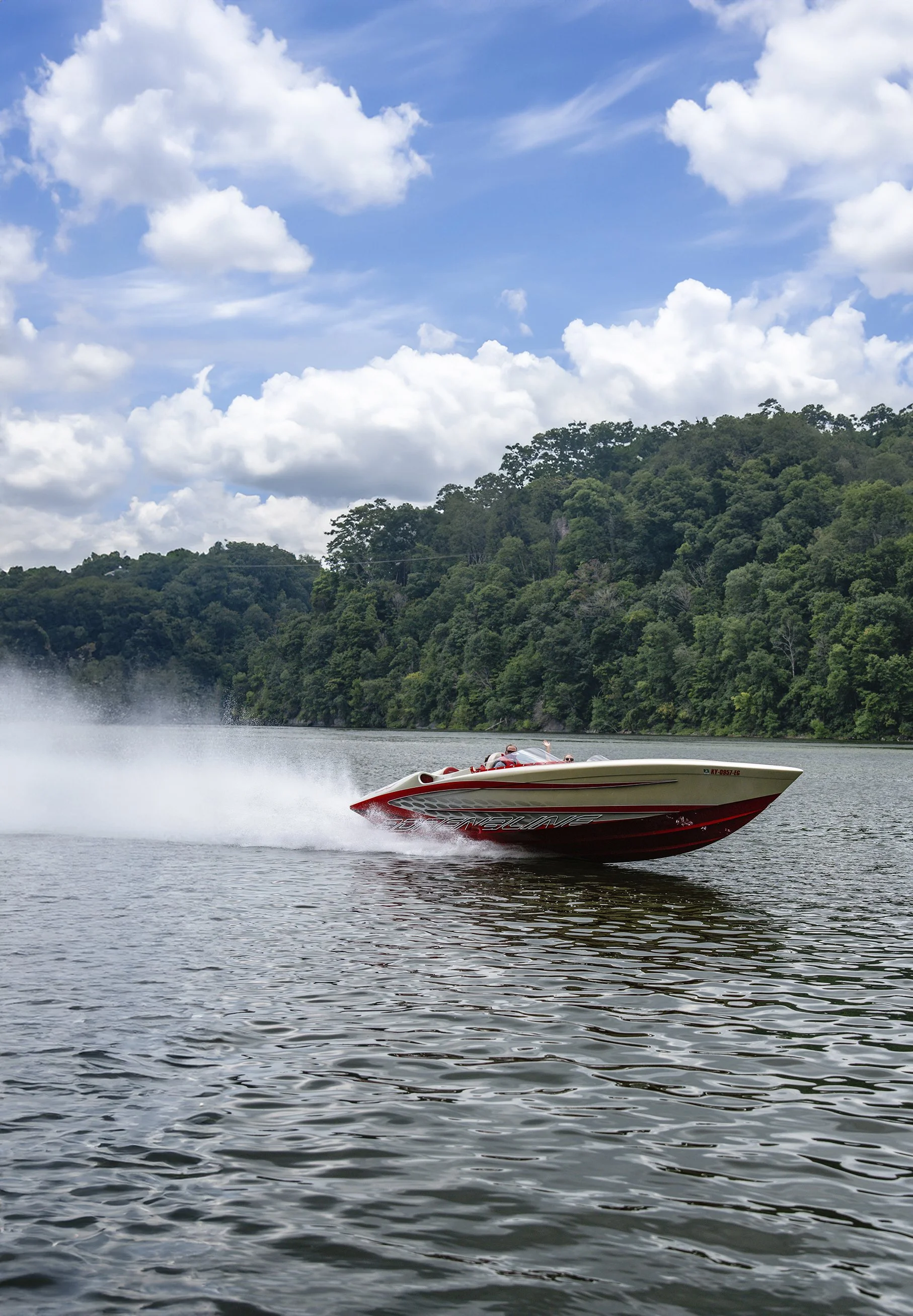speed boat racing across lake