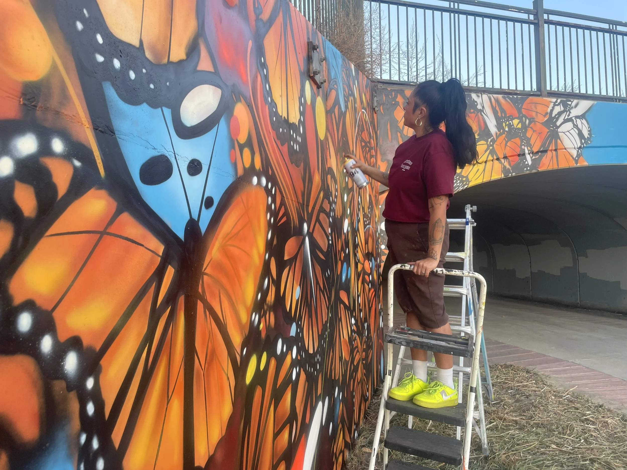 Woman painting mural