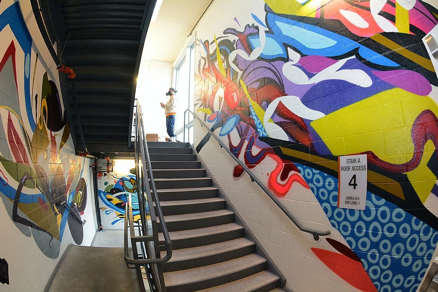 Interior abstract stairwell mural by Guerilla Garden created for the Denver Housing Authority in Denver, Colorado. Collaborative mural with Rubén Aguirre Likes1.