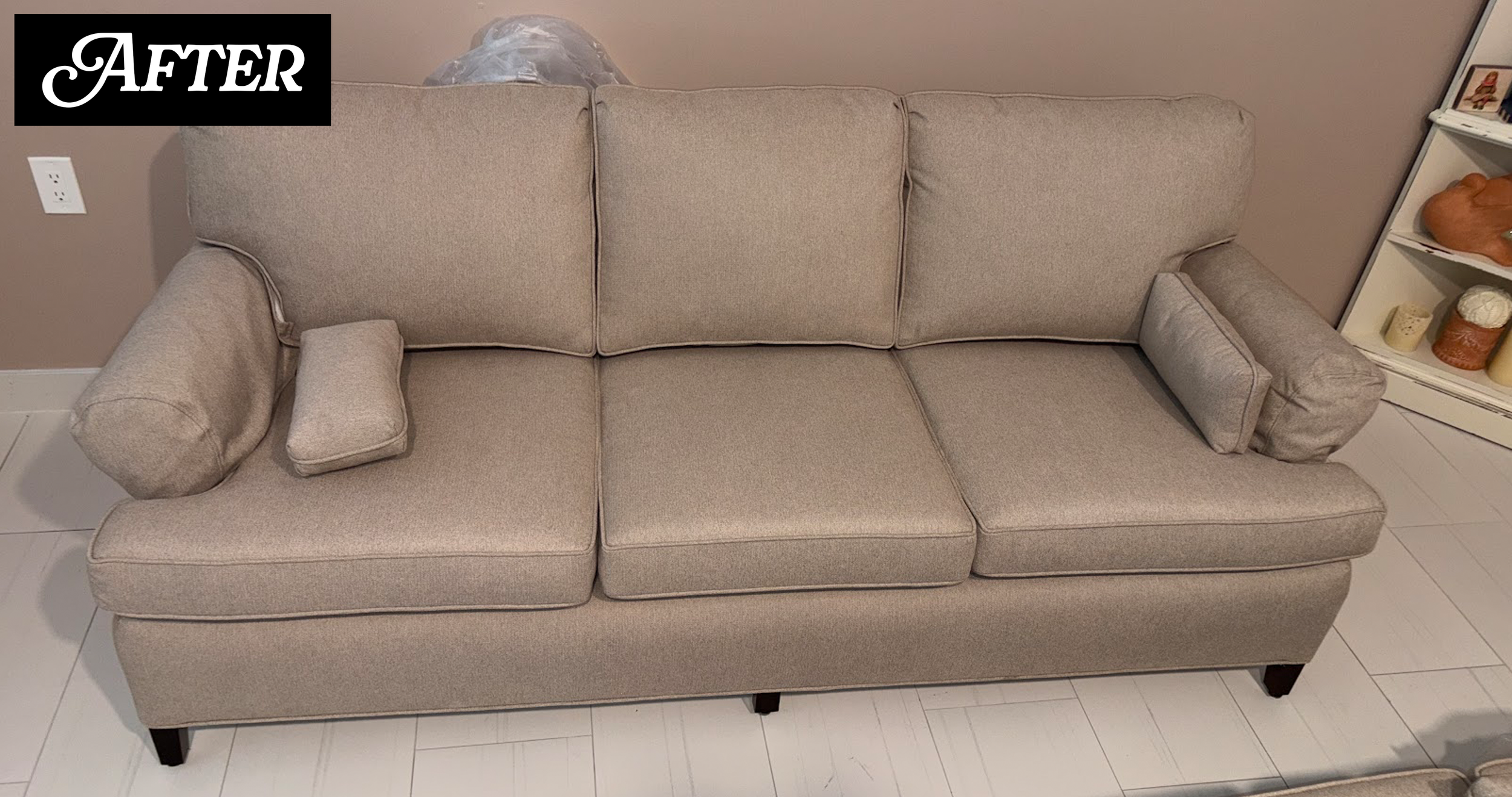 A beige fabric sofa with three cushions and armrest pillows, situated in a room with a white tiled floor and a beige wall. There is a black and white label with the word 'AFTER' in the top left corner.