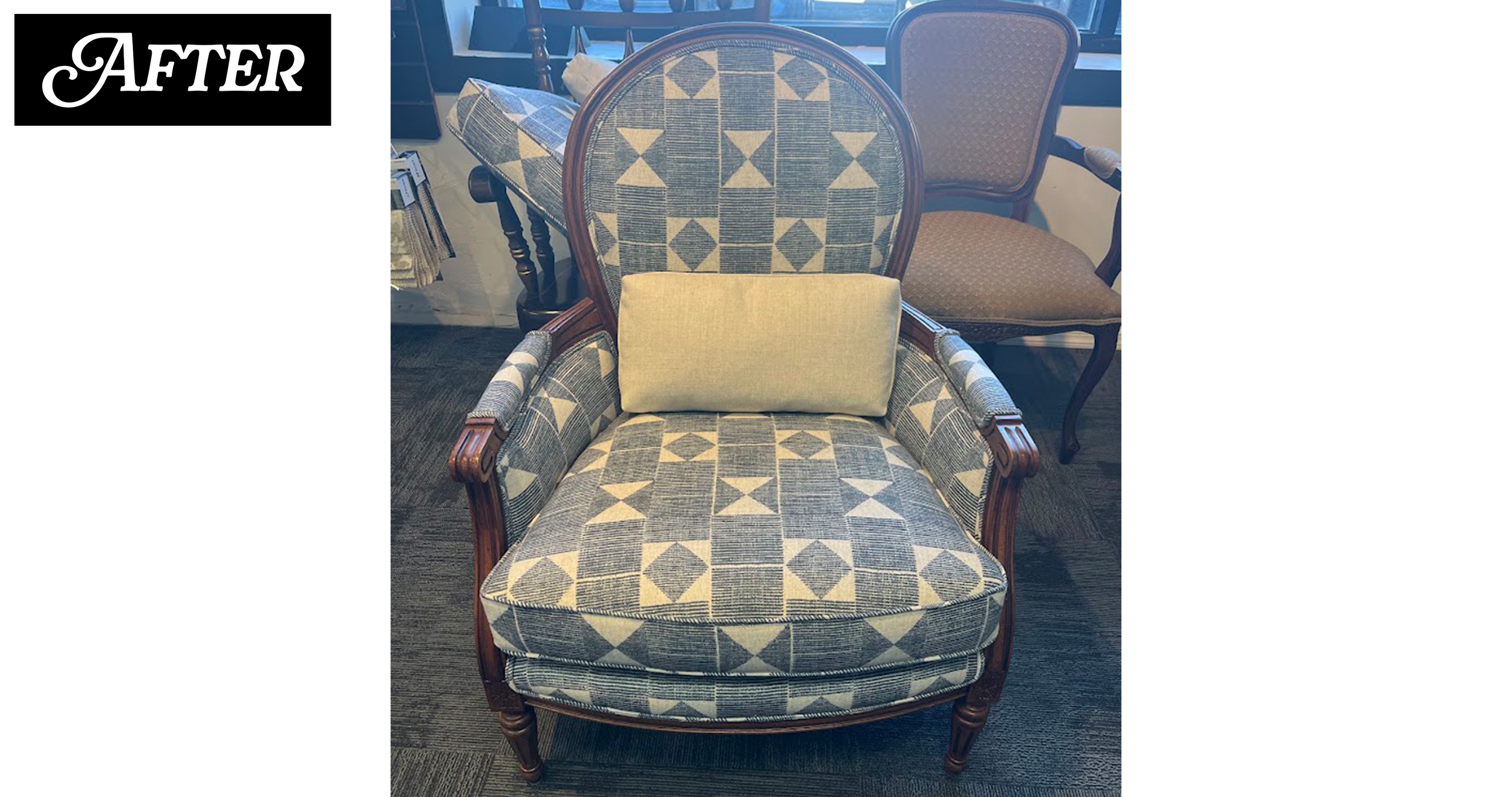 An upholstered armchair with wooden frame and patterned fabric, featuring a light-colored pillow on the seat, positioned in a furniture store.