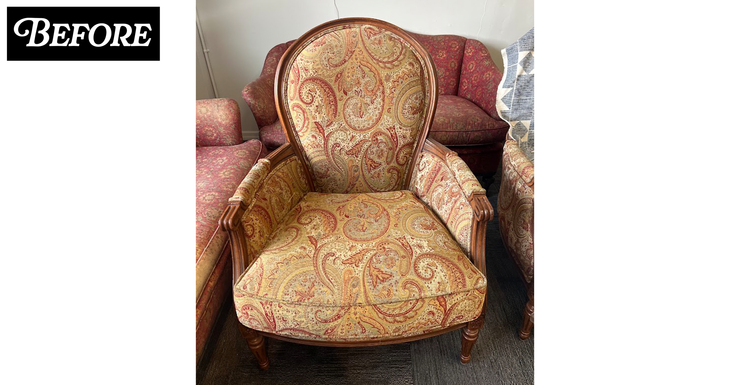 An antique armchair with ornate wooden frame and yellow-and-orange paisley-patterned upholstery, surrounded by other vintage upholstered furniture in a room.