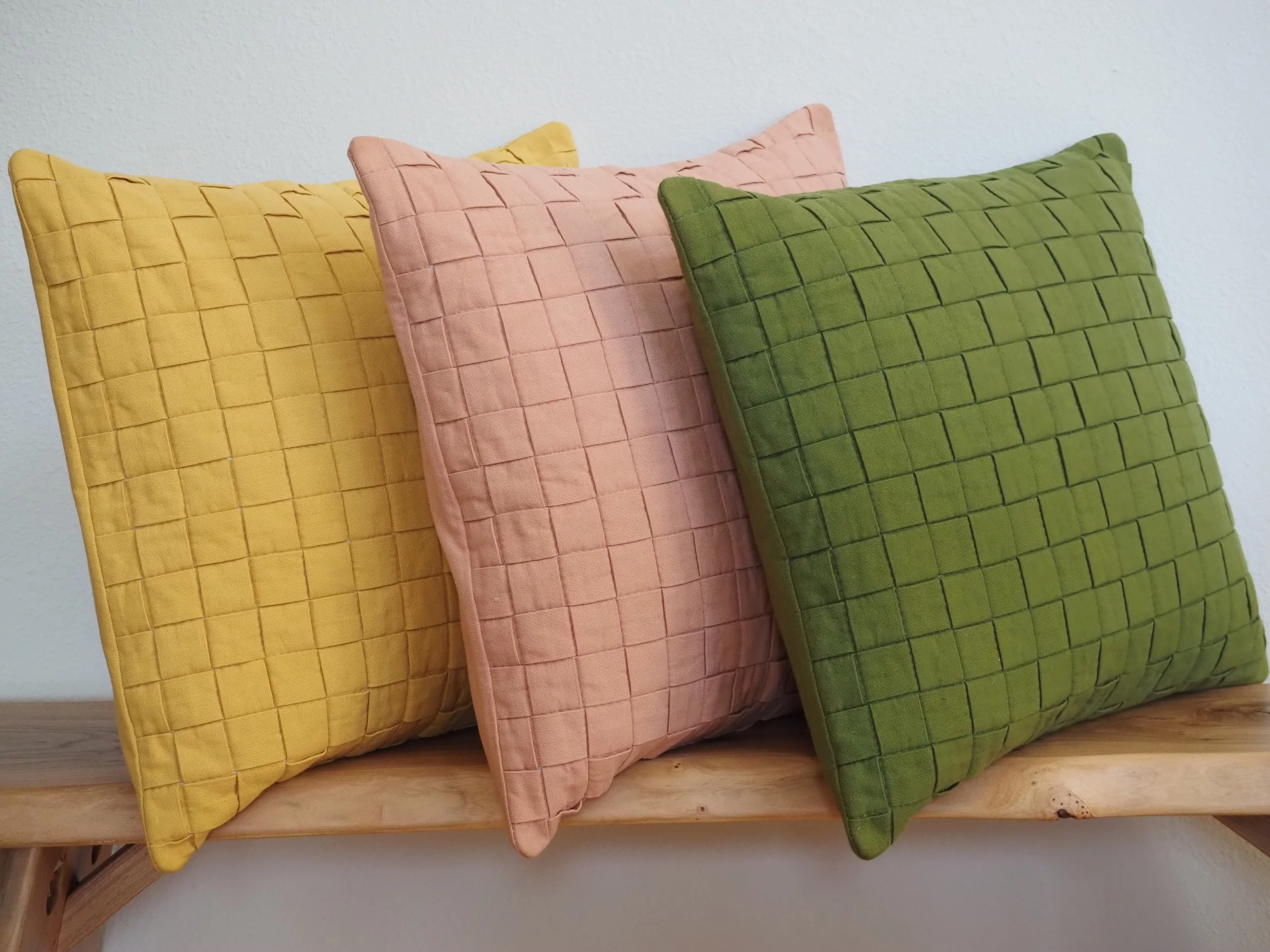 Handmade basketweave cotton throw pillows 18x18 on bench