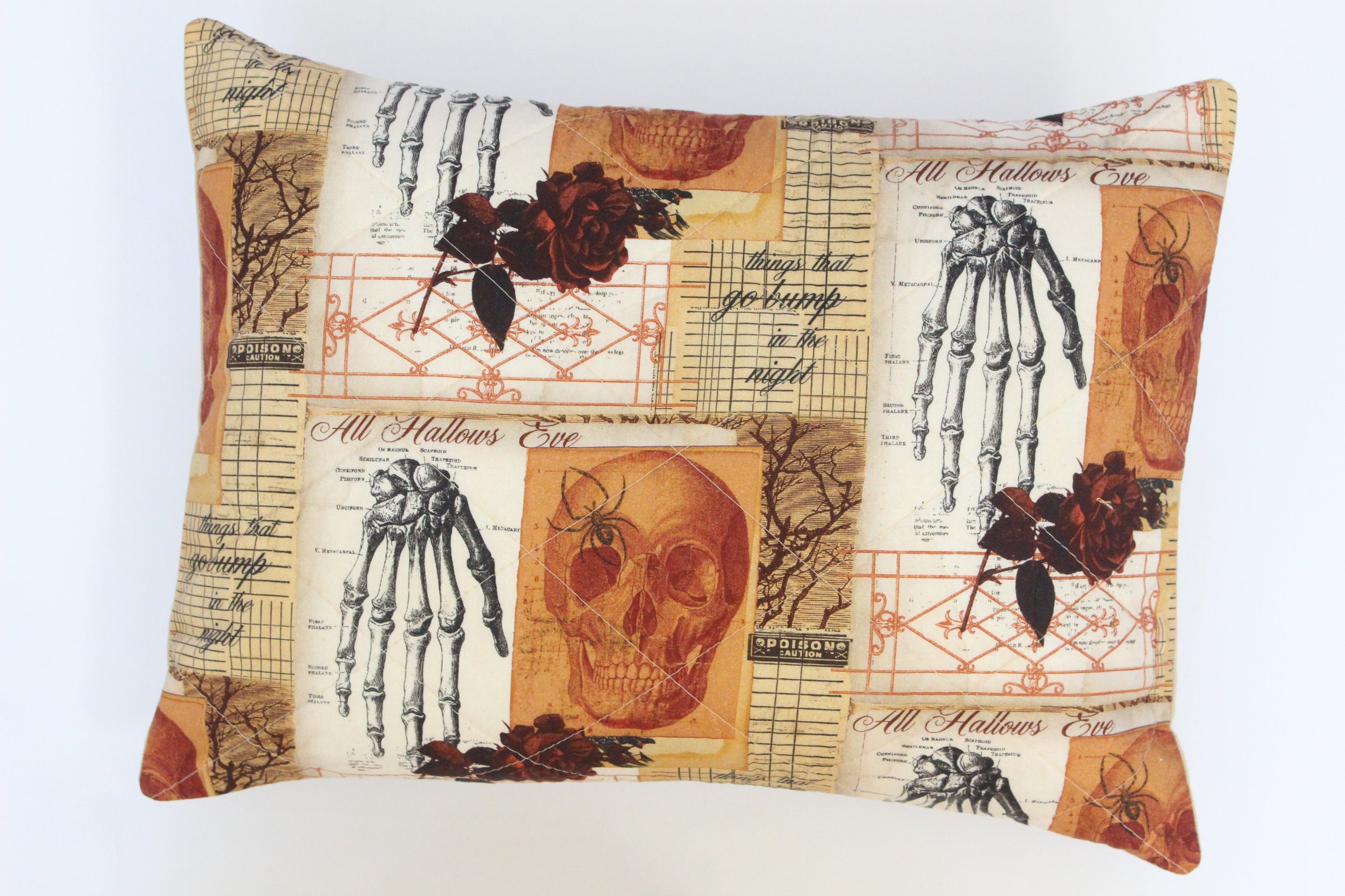 Handcrafted 12x16 quilted skeleton skull pillow cover styled on sofa