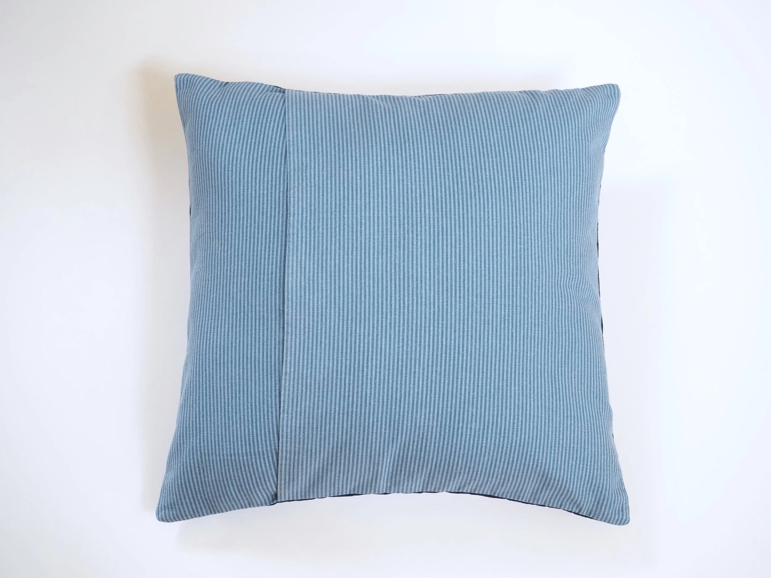 Back envelope closure on blue pinstripe cotton canvas 18x18 cushion cover