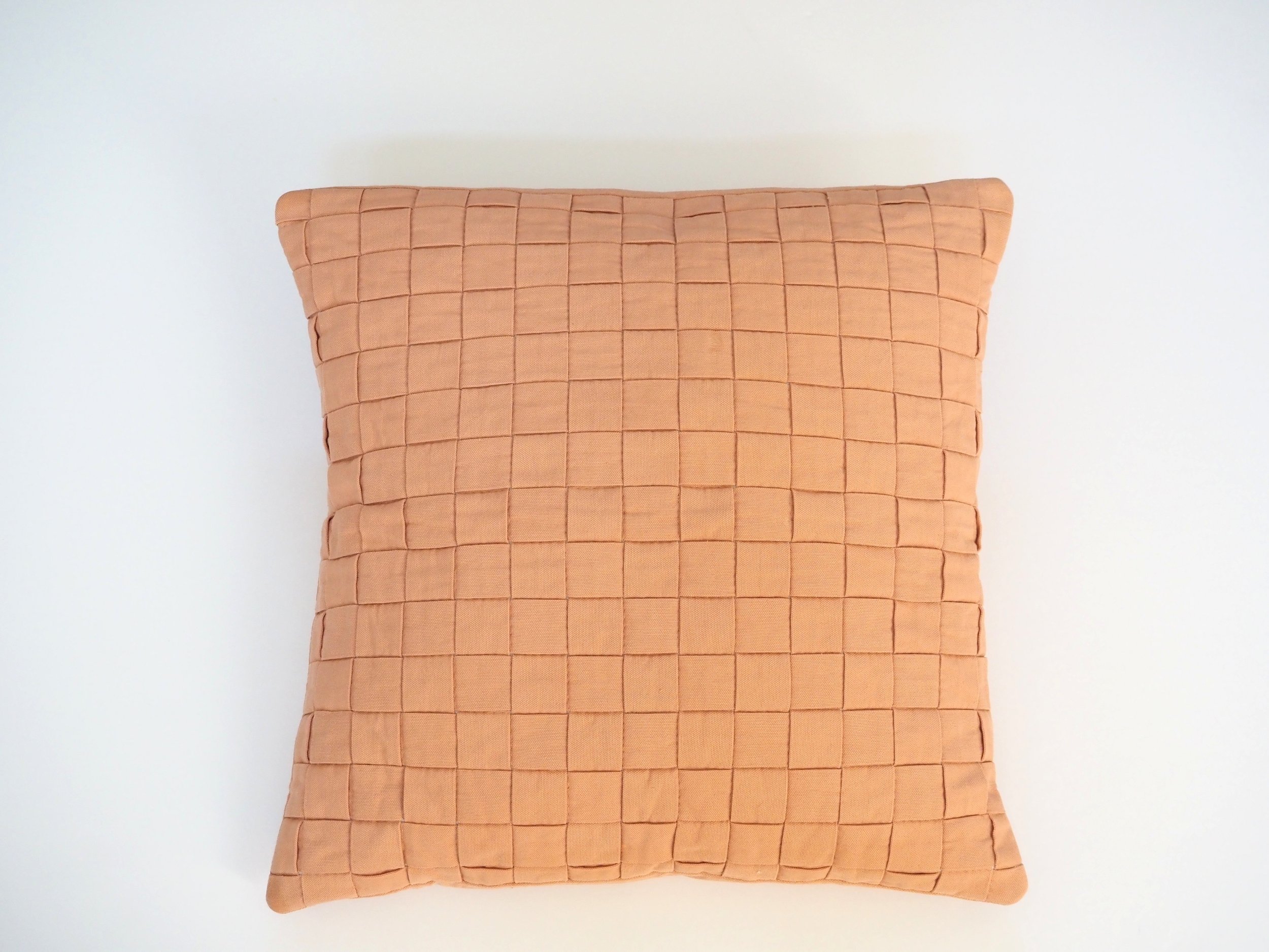 Light terracotta cotton duck pillow close up texture detail