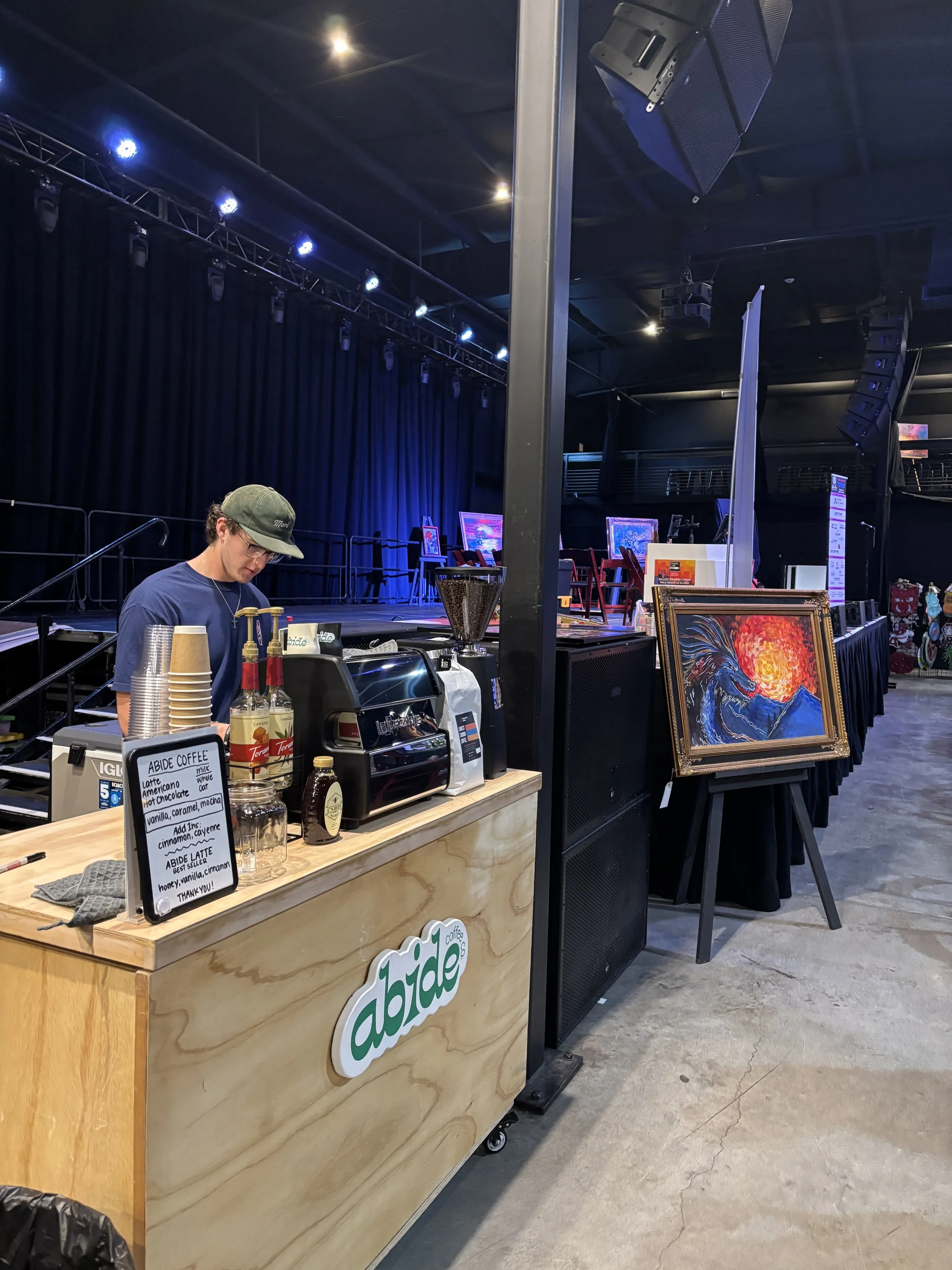 Barista preparing espresso drinks at mobile coffee bar event