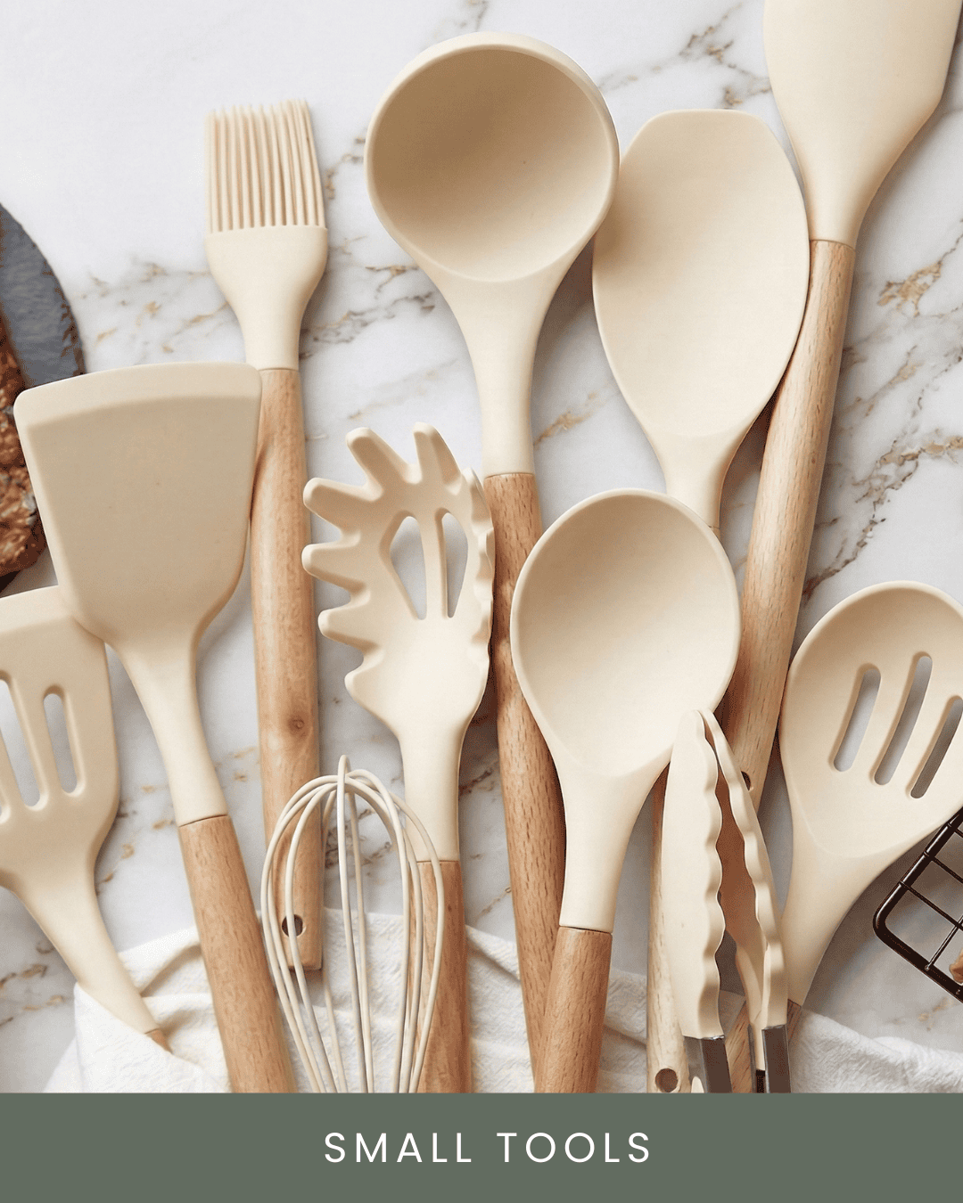 A collection of beige kitchen utensils with wooden handles on a marble surface, including spatulas, a whisk, and tongs, labeled 'Small Tools'.