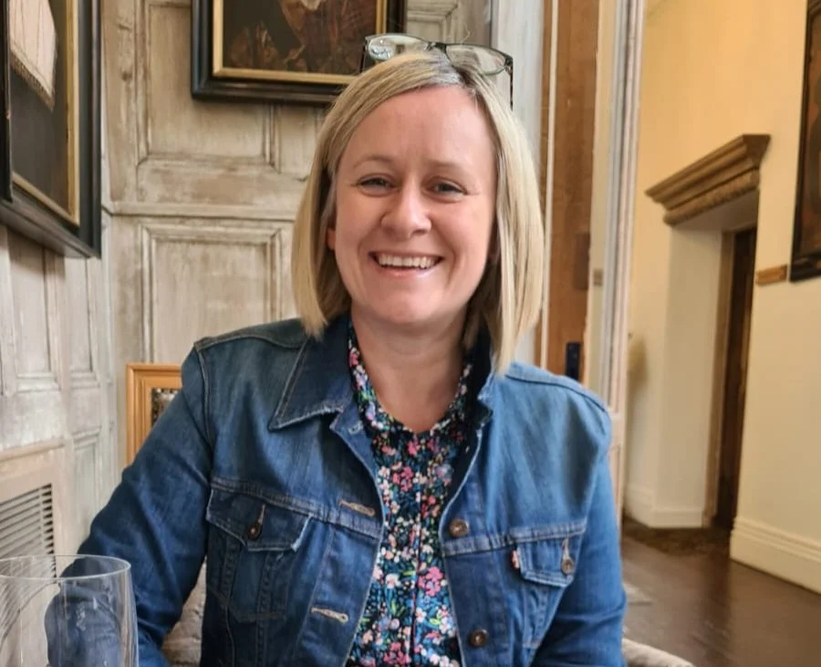 Image shows Inclusive E-learning owner, Jo Cottingham. She is smiling at the camera.