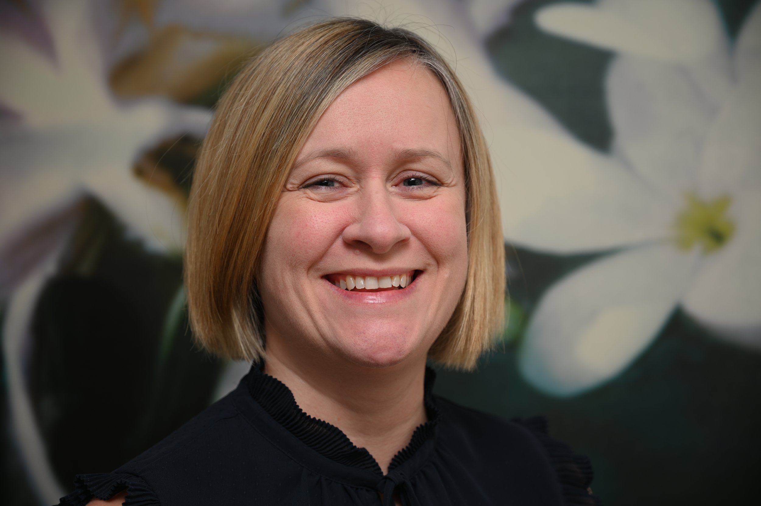 Image shows Inclusive E-learning's owner, Jo Cottingham. She is smiling into the camera.