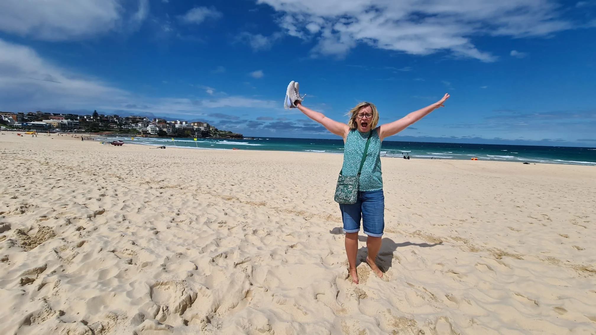 Image shows Jo on a beach in Australia.