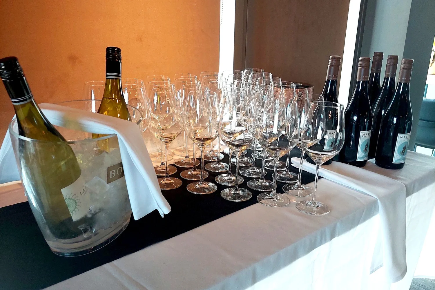 Wine and glassware prepared for arriving guests