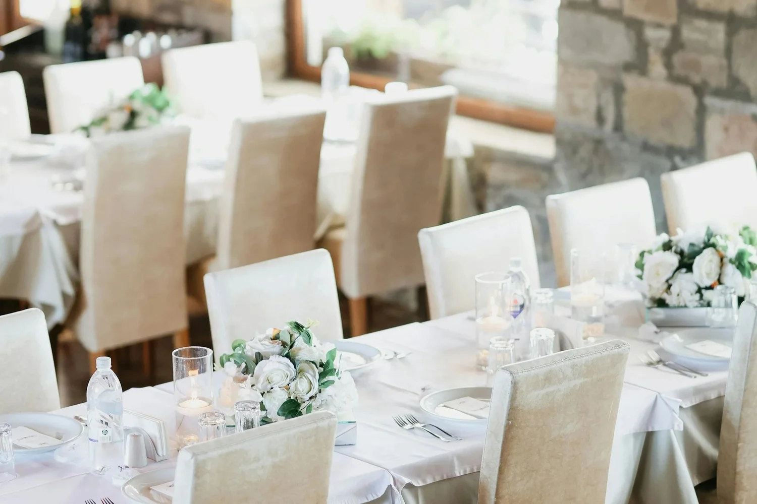 A bright dining room arranged for a relaxed wedding gathering