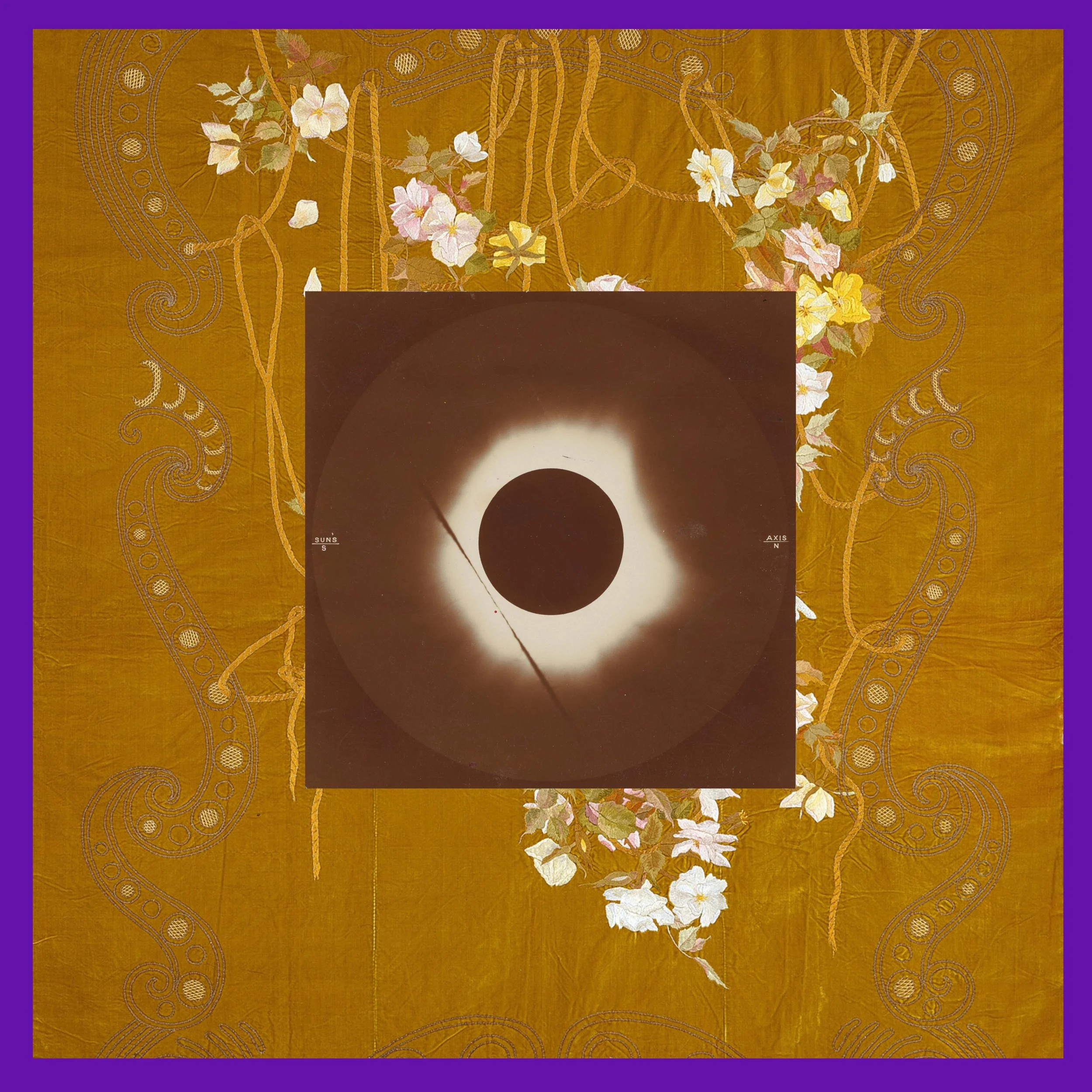 A photograph of a solar eclipse with the sun's corona visible around the dark moon, framed by a decorative cloth with floral and paisley patterns.